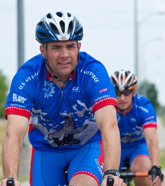 Lt. Cols. David Henshaw, 28th Operations Support Squadron director of operations, and Derek Leivestad, 28th Bomb Wing deputy chief of safety, ride around Ellsworth Air Force Base, S.D., July 17, 2012 while training for the Air Force cycling team’s annual participation in the Register’s Annual Great Bicycle Ride Across Iowa on July 22. The Air Force highlights the AF Cycling Team’s participation in RAGBRAI as a recruiting tool, similar to the AF Marathon. (U.S. Air Force photo by Airman 1st Class Zachary Hada/Released)
