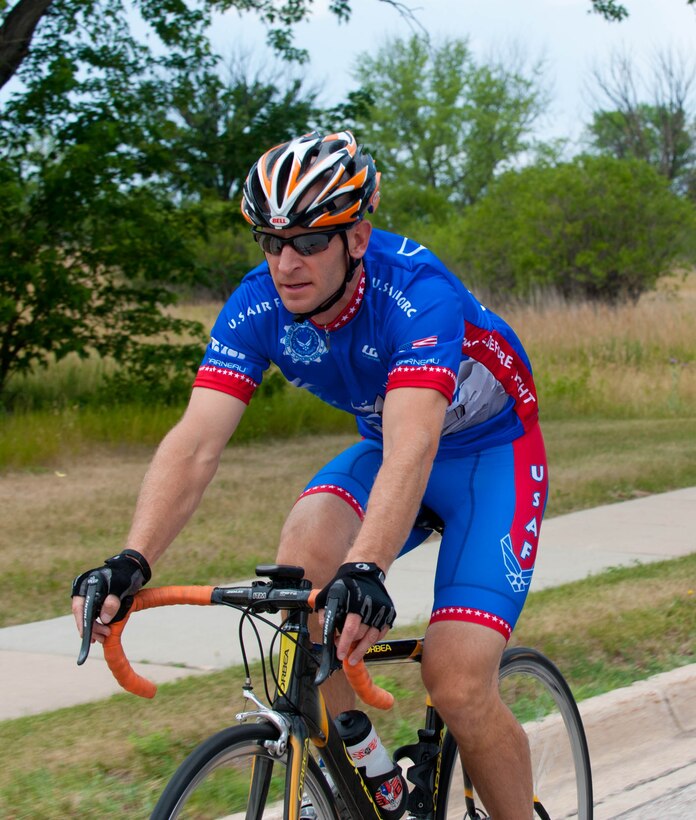 Lt. Col. Derek Leivestad, 28th Bomb Wing deputy chief of safety, ride across Ellsworth Air Force Base, S.D., July 17, 2012 while training for the Register’s Annual Great Bicycle Ride Across Iowa event on July 22. Every year, Airmen from all around the world sign up for the Air Force cycling team’s annual participation in RAGBRAI. (U.S. Air Force photo by Airman 1st Class Zachary Hada/Released)