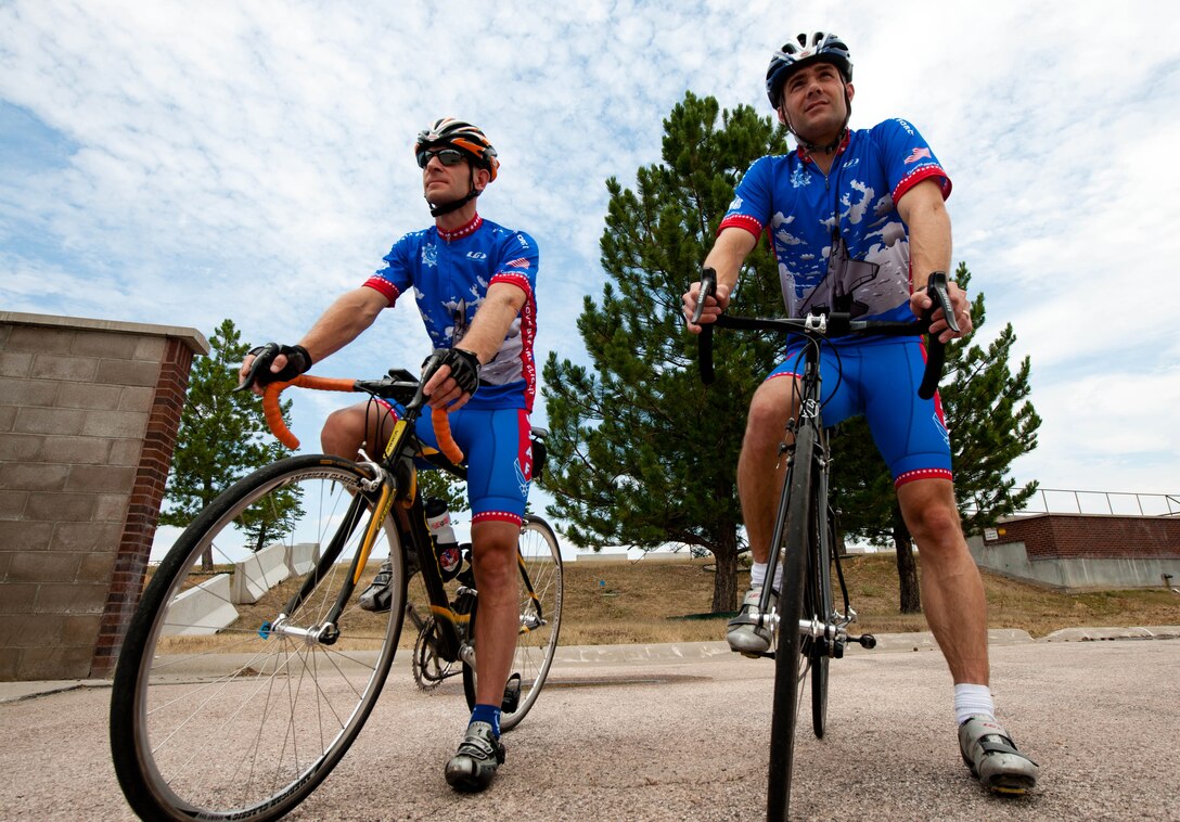 Lt. Cols. Derek Leivestad, 28th Bomb Wing deputy chief of safety, and David Henshaw, 28th Operations Support Squadron director of operations, assess the proposed route prior to hitting the road at Ellsworth Air Force Base, S.D., July 17, 2012. The two cyclists are training for Register’s Annual Great Bicycle Ride Across Iowa on July 22. RAGBRAI, started in 1973 by two Des Moines Register columnists, is the oldest, largest, and longest bicycle touring event in the world and now encompasses seven days of riding, averaging 468 miles. (U.S. Air Force photo by Airman 1st Class Zachary Hada/Released)