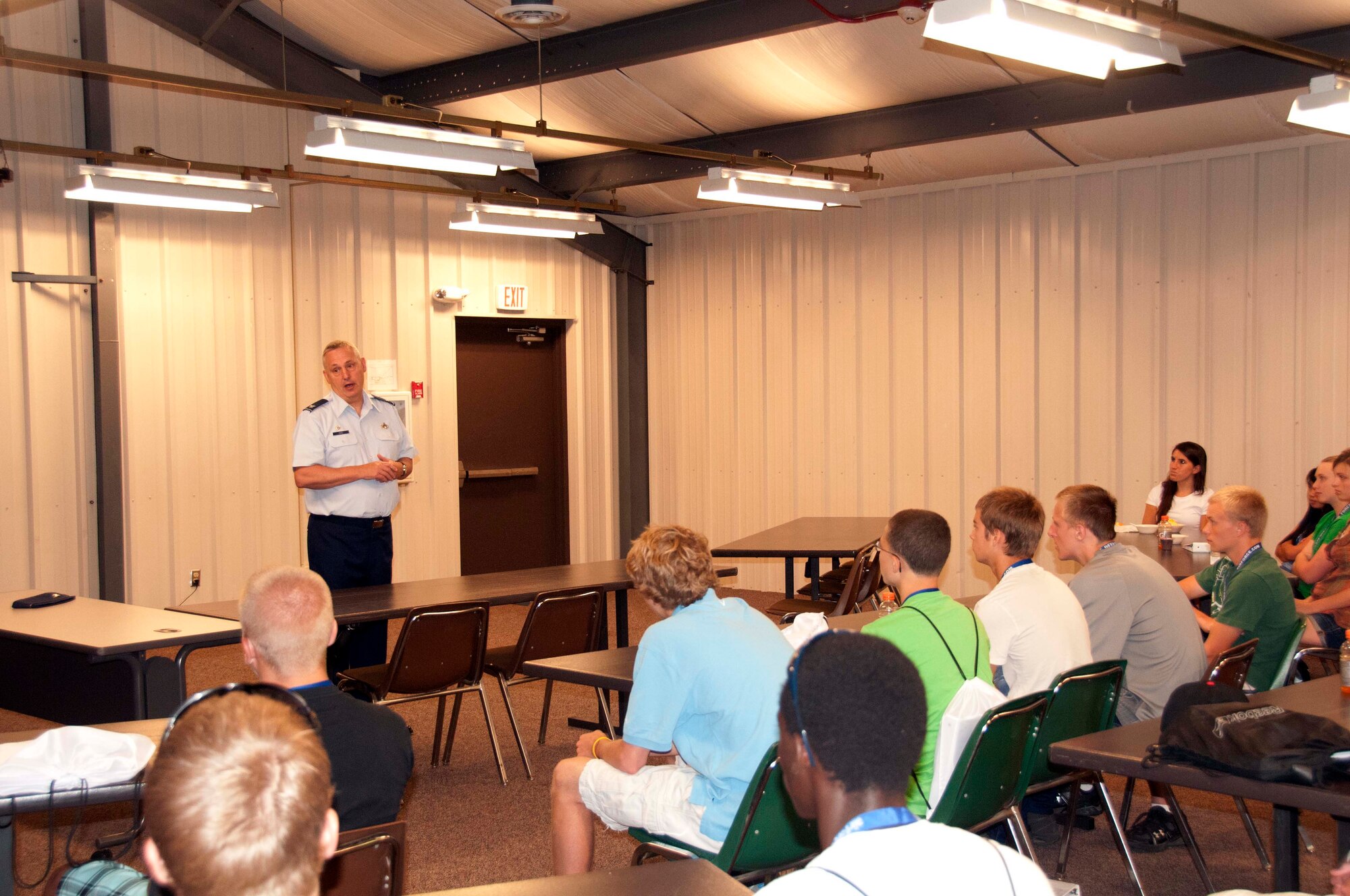 Col. Michael Ochs, 934th Mission Support Group commander, welcomes Aviation Career Education students to the 934th Airlift Wing July 15.  The students spend a week studying aviation fundamentals, visiting local aviation-related facilities and fly on an orientation flight on an Air Force C-130 Aircraft. (Air Force Photo/Paul Zadach)