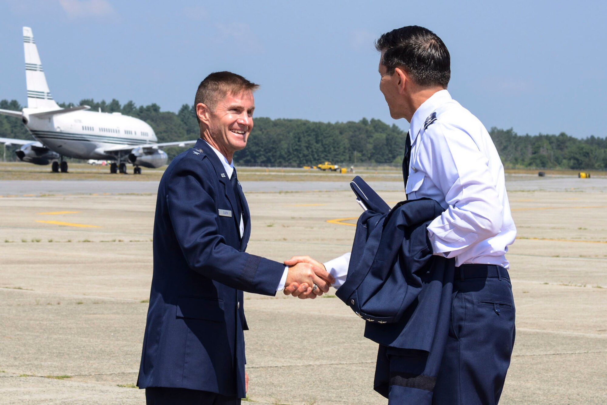 HANSCOM AIR FORCE BASE, Mass. – Maj. Gen. Craig S. Olson (left), who has been selected by the Air Force to become the PEO for C3I and Networks, greets Lt. Gen. C.D. Moore II, Air Force Life Cycle Management Center commander, upon his arrival to the base July 16. Olson was visiting the base to attend the Electronic Systems Center Transition Ceremony and learn more about his new programs and missions. (U.S. Air Force photo by Walter Santos)