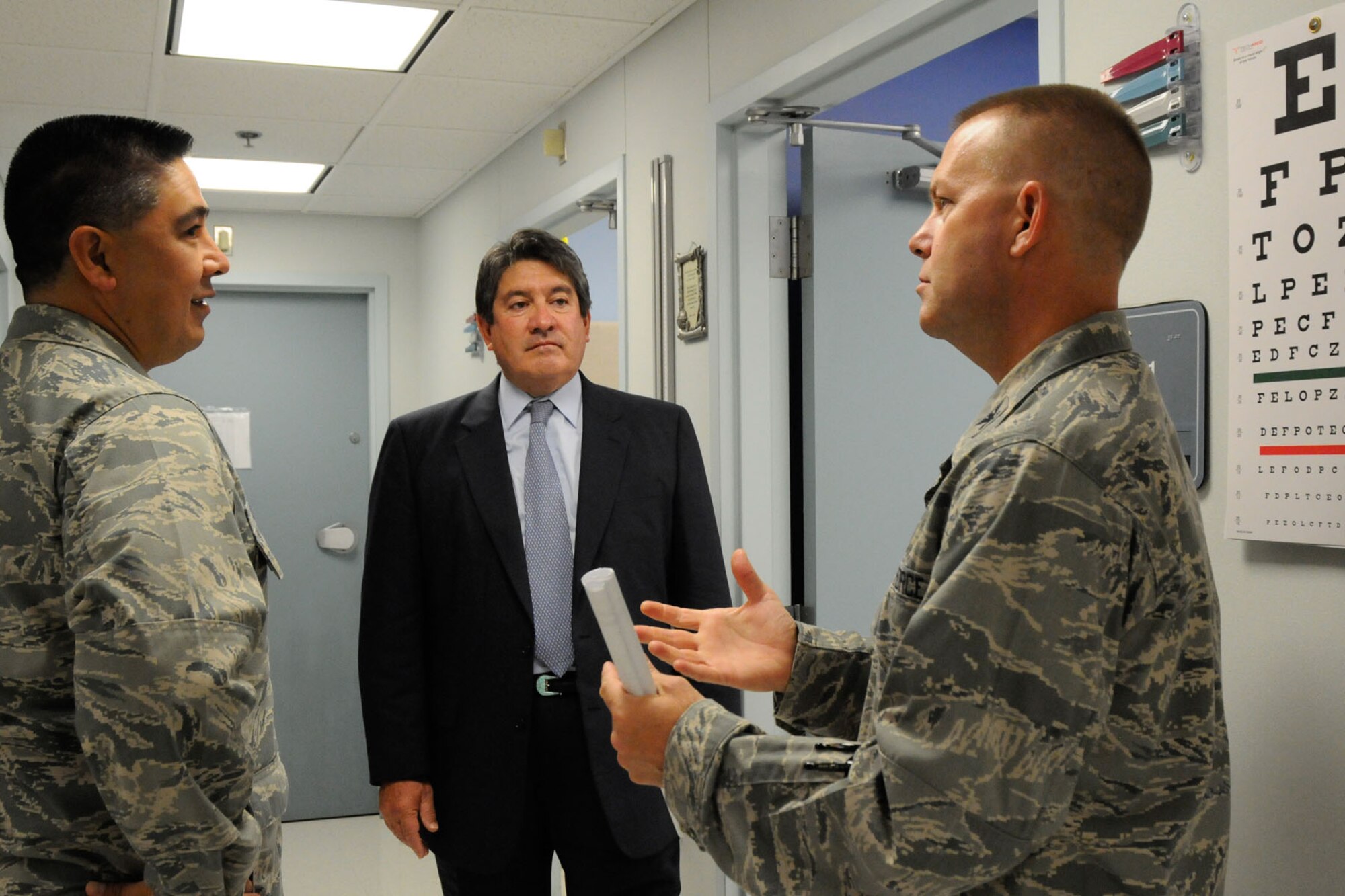 HANSCOM AIR FORCE BASE, Mass. – Edmundo A. Gonzales (center), senior adviser to the Assistant Secretary of the Air Force for Manpower and Reserve Affairs, receives a tour of the 66th Medical Squadron clinic from Col. Frank Glenn, 66 MDS commander, and Lt. Col. Artemio Chapa, Medical Staff chief, July 12. Gonzales, who provides guidance, direction and oversight for the Air Force's Wounded Warrior and Yellow Ribbon Reintegration programs, visited the base to receive an overview of how Hanscom supports wounded warriors. (U.S. Air Force photo by Linda LaBonte Britt)