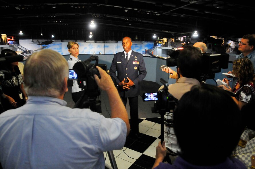 Brig. Gen. Cedric D. George talks with media prior to the ceremony for the standup of the Warner Robins Air Logistics Complex July 17.  (U. S. Air Force photo/Sue Sapp)