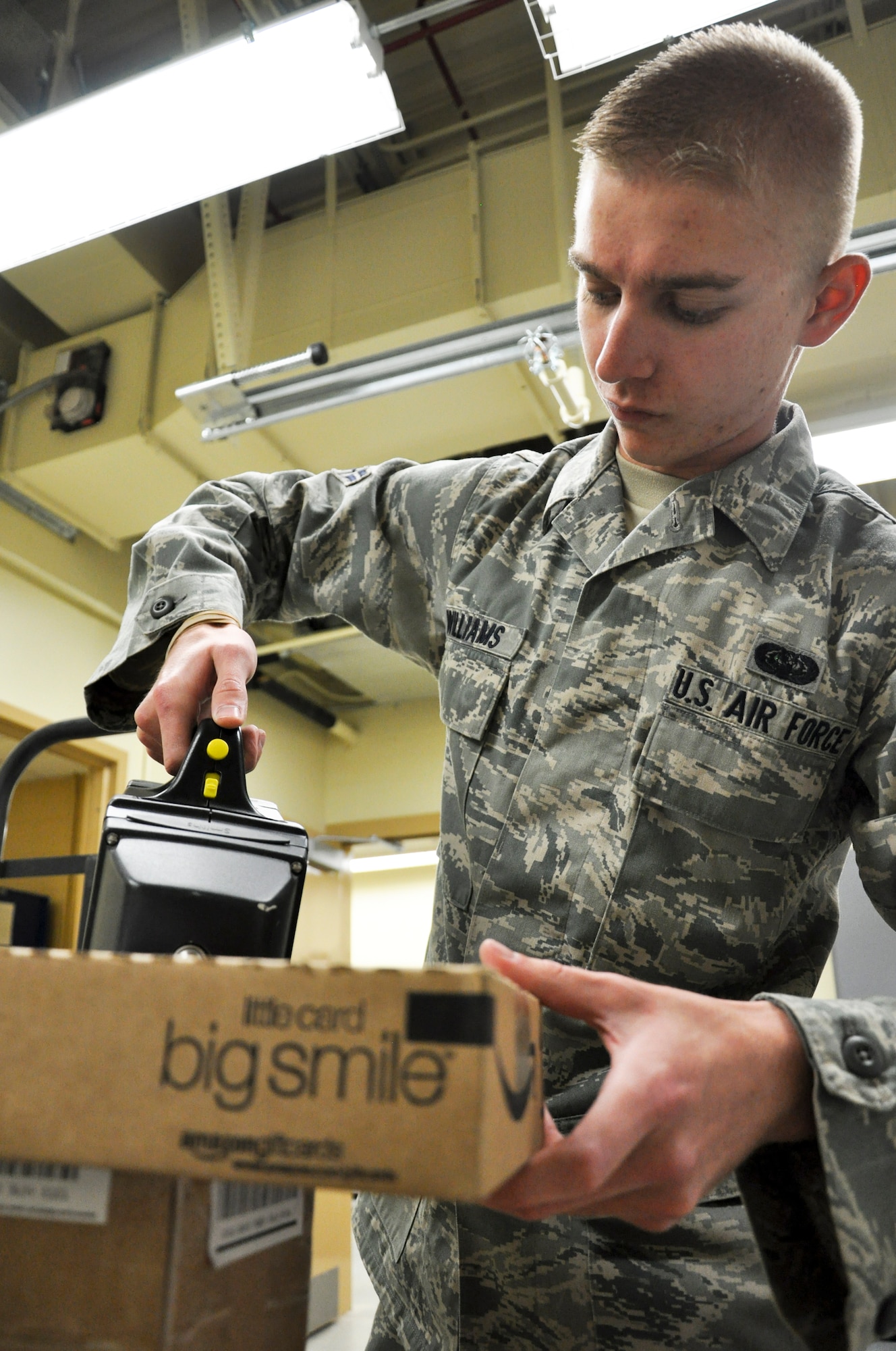 BUCLKEY AIR FORCE BASE, Colo. – Airman 1st Class Dyalan Williams, Buckley’s Official Mail Center internal mail technician, scans a package for biological and explosive material.  The mail center can process anywhere from approximately 2,000 to 12,000 pieces of mail each day.  (U.S. Air Force photo by Staff Sgt. Nicholas Rau)