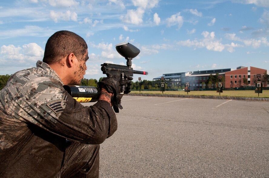 HANSCOM AIR FORCE BASE, Mass. – Staff Sgt. Jeremy Guidry shoots a paint ball gun at a target during Warrior Day July 11. In addition to combat physical training, participants took part in a mentoring lunch, open ranks inspection and a retreat ceremony. (U.S. Air Force photo by Rick Berry)
