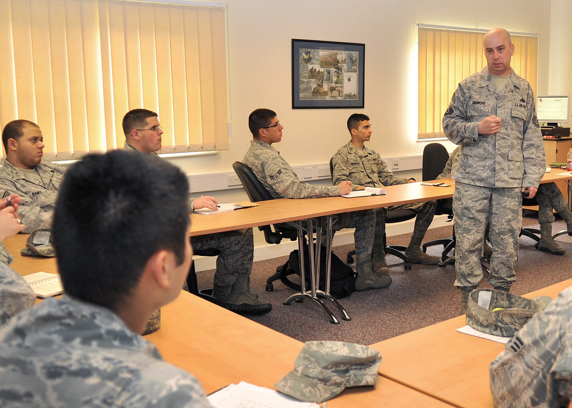 RAF MILDENHALL, England - Chief Master Sgt. Gary Dizmond, 95th Reconnaissance Squadron, addresses an Airman’s question during an enlisted performance report-writing course at the Professional Development Center on RAF Mildenhall here July 17, 2012. The PDC offers 25 courses every quarter, and aims to help Airmen develop professionally and personally. (U.S. Air Force photo/Senior Airman Jerilyn Quintanilla)