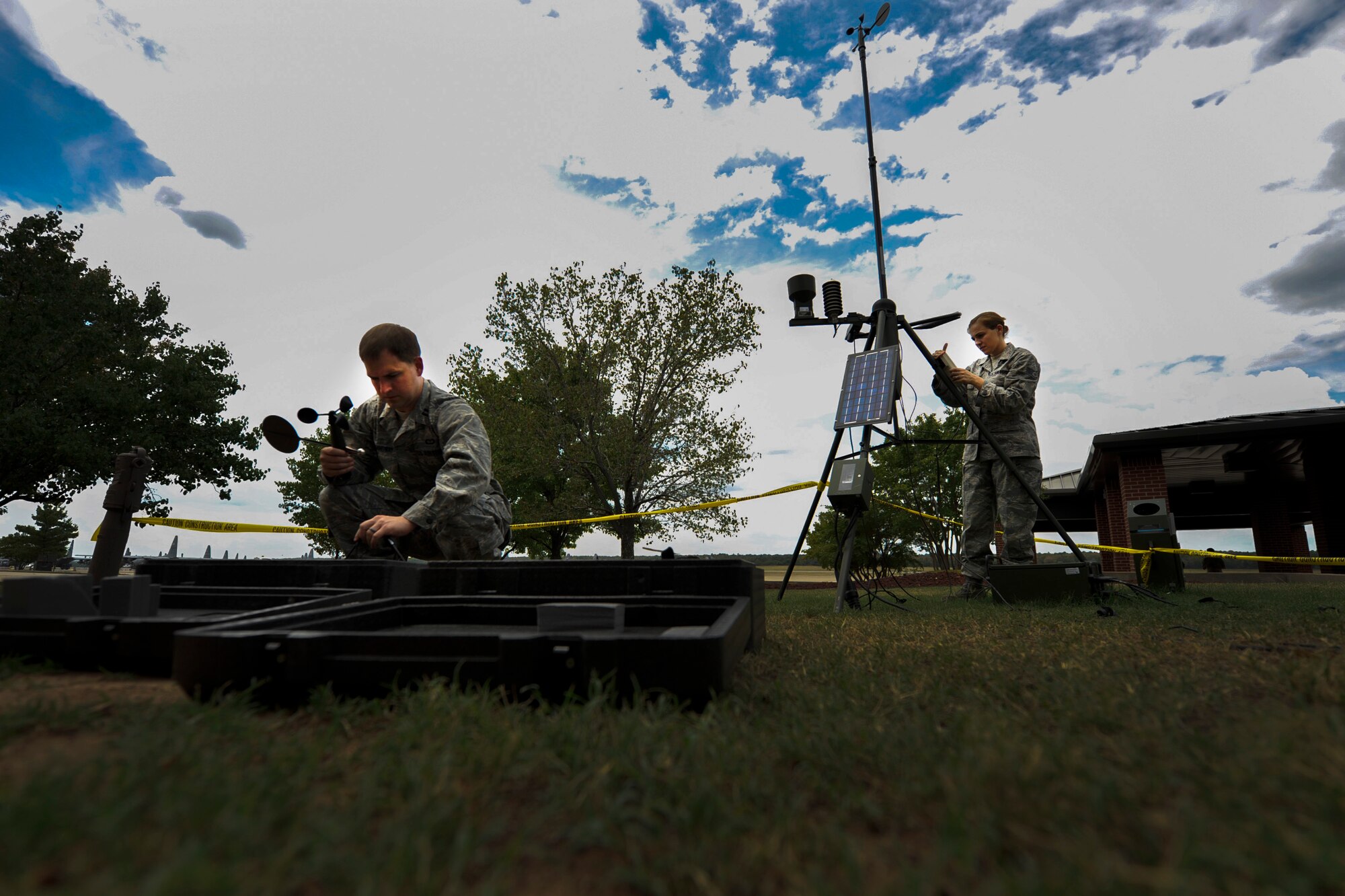 Capt. Matt Hemingway, a 19th Operations Support Squadron weather operations officer and Staff Sgt. April Stanford, a 19th OSS non commissioned officer in charge of weather flight, set up tactical meteorological equipment July 10, 2012, at Little Rock Air Force Base, Ark. Members of the Weather Flight set up the equipment to train for deployments.(U.S. Air Force photo by Airman 1st Class Rusty Frank)
