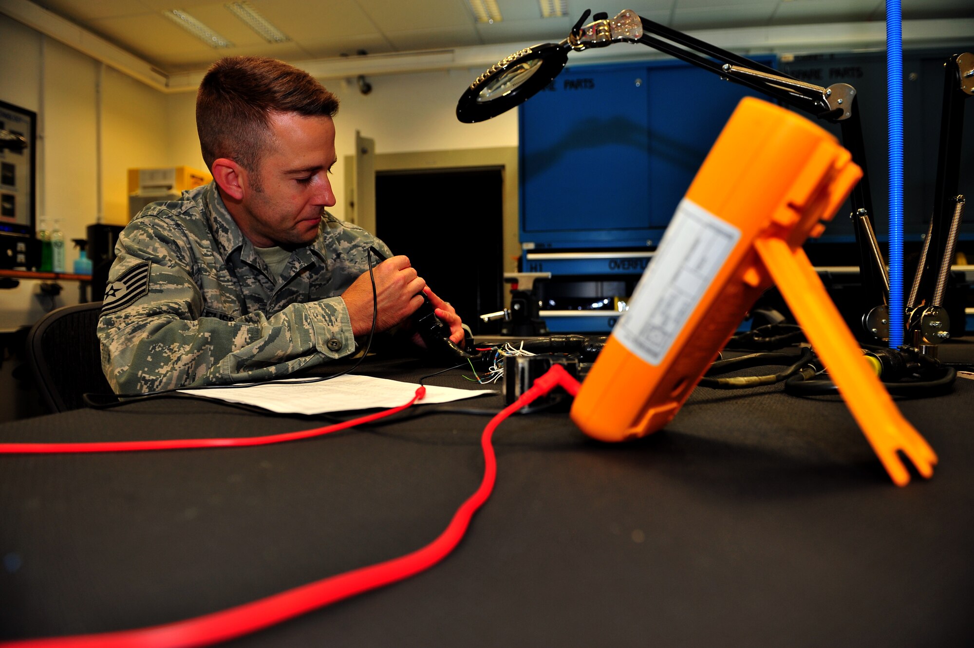 SPANGDAHLEM AIR BASE, Germany – Tech. Sgt. Robert Fuss, 52nd Maintenance Group Air Force repair enhancement program manager, performs a functions check on a circuit of an armament test station harness inside the 52nd MXG AFREP section here July 17. The AFREP section fixes items that cannot be contracted out for repair and items that are cheaper to repair than replace. The majority of the services provided by the shop is for the 52nd Maintenance Group, but they can also help other groups within the 52nd Fighter Wing. The section saved more than $1 million last year for the Air Force while maintaining a credible combat power. (U.S. Air Force photo by Airman 1st Class Dillon Davis/Released)