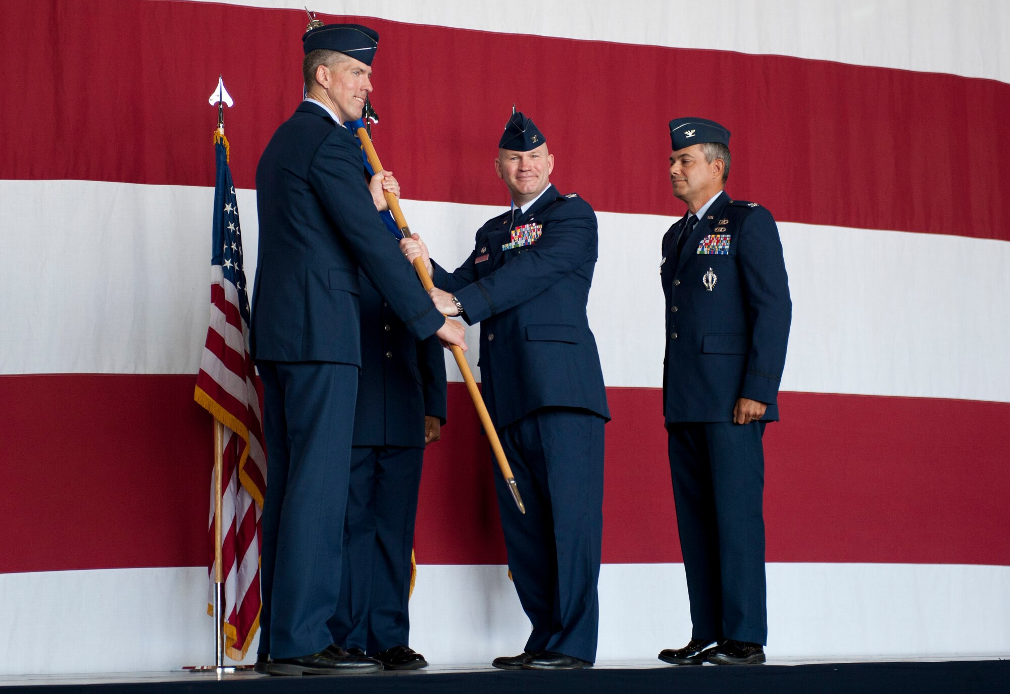 Col. Scott Enold, outgoing 39th Mission Support Group commander, relinquishes command of the 39th MSG to Col. Chris Craige, 39th Air Base Wing commander, during the change-of-command ceremony July 18, 2012, at Incirlik Air Base, Turkey. Enold was replaced by Col. Sean Gallagher. (U.S. Air Force photo by Senior Airman Anthony Sanchelli/Released) 