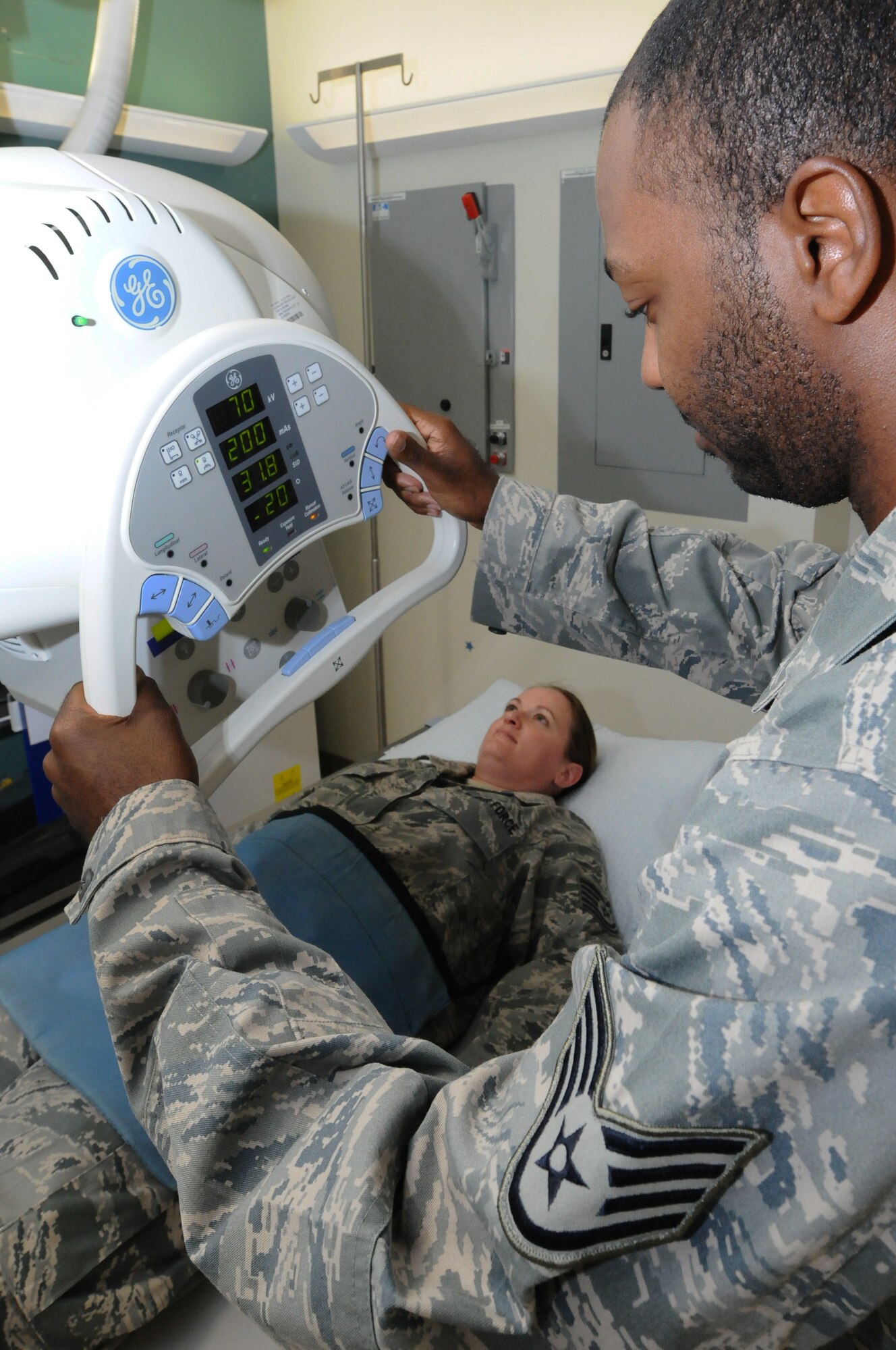 ANDERSEN AIR FORCE BASE, Guam - Staff Sgt. Jahmal Nicholas, 36th Medical Support Squadron diagnostics imaging craftsman, aligns crosshairs for the x-ray machine after placing a lead blanket over the patient July 18. Aligning the field of view makes sure that only the selected portion of the patient will be x-rayed. (U.S. Air Force photo by Senior Airman Carlin Leslie/Released)