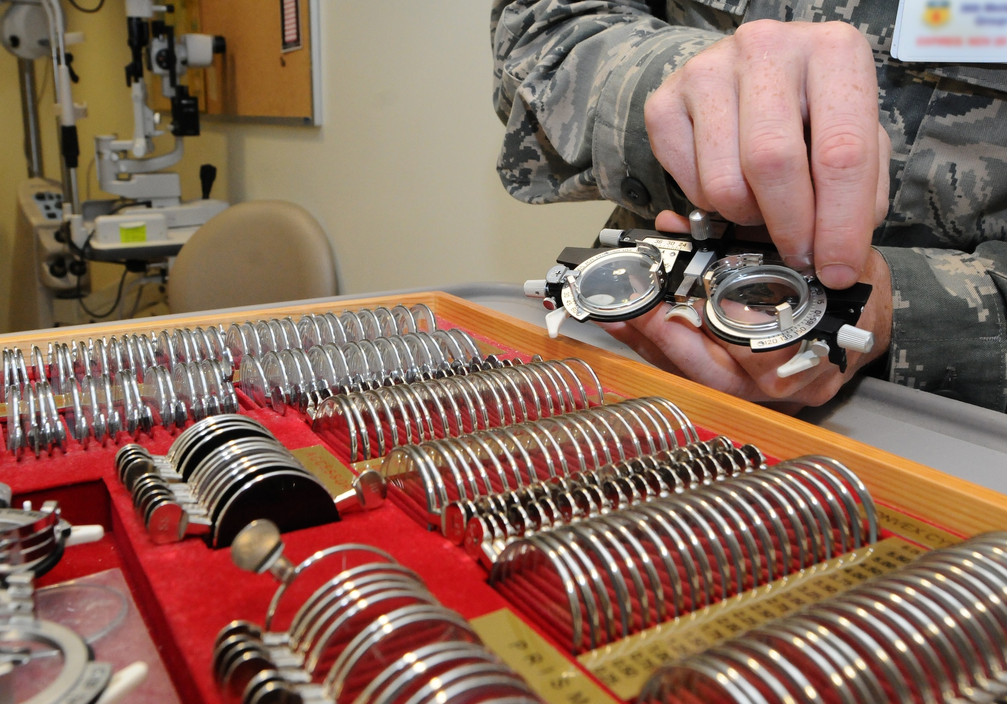 ANDERSEN AIR FORCE BASE, Guam – A technician selects trial lenses to be used in a patient’s prescription July 18. By using trial lenses, the technician can make sure the prescription is correct for the patient.  (U.S. Air Force photo by Senior Airman Carlin Leslie/Released)