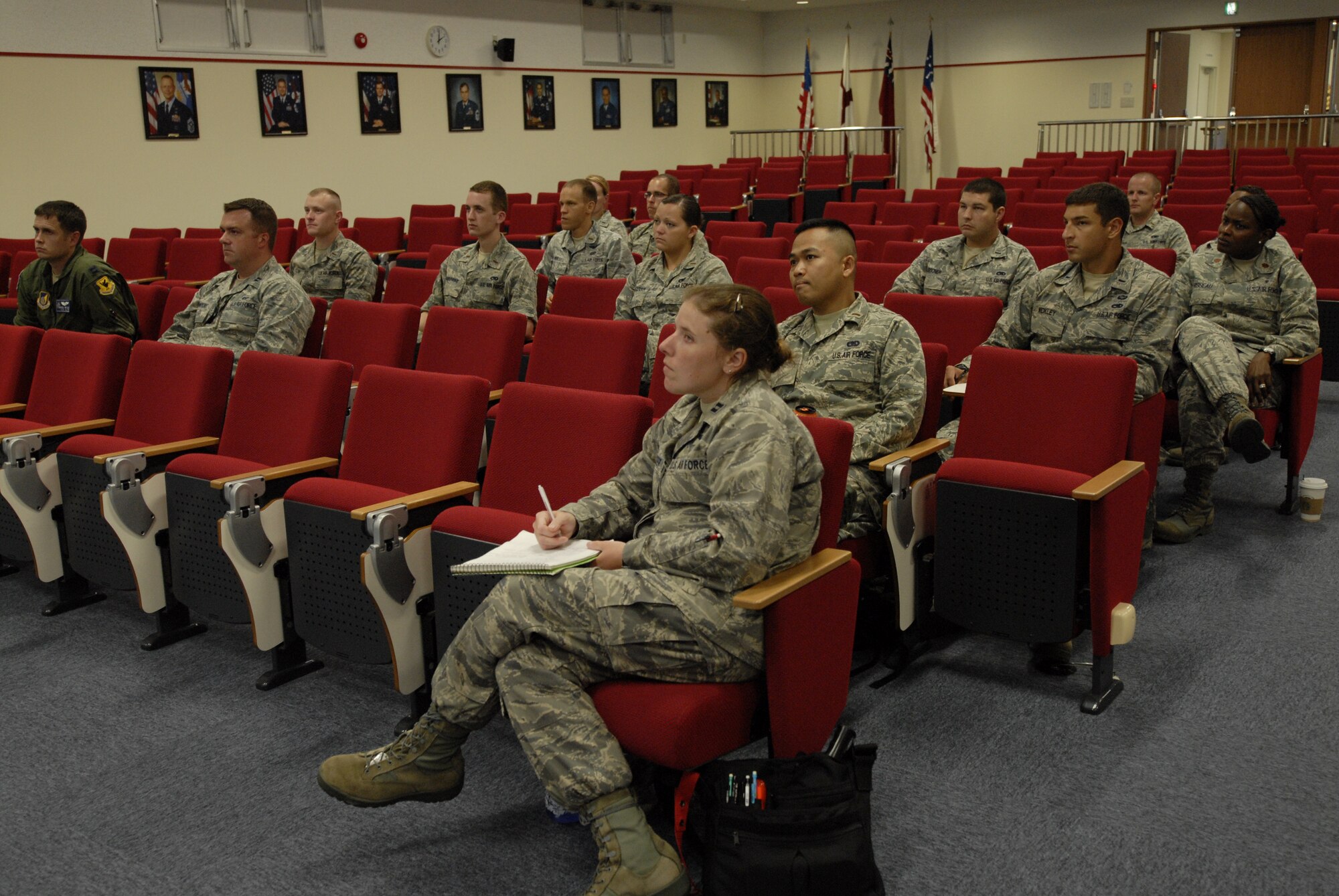 Officers in the Flight Commander’s Course listen to an Inspector General brief on Kadena Air Base, Japan, July 17, 2012. U.S. Air Force Capt. Nicholas Baker, 961st Airborne Air Control Squadron air battle manager, coordinates with the base agencies to ask them to volunteer their time to give a brief for the officers who attend the Flight Commander’s Course. (U.S. Air Force photo/Airman 1st Class Malia Jenkins)  