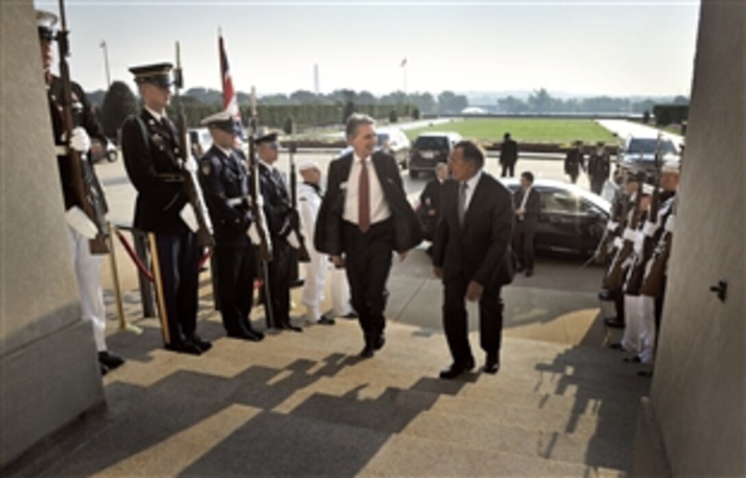 U.S. Defense Secretary Leon E. Panetta hosts an honor cordon to welcome British Defense Secretary Philip Hammond to the Pentagon, July 18, 2012. 