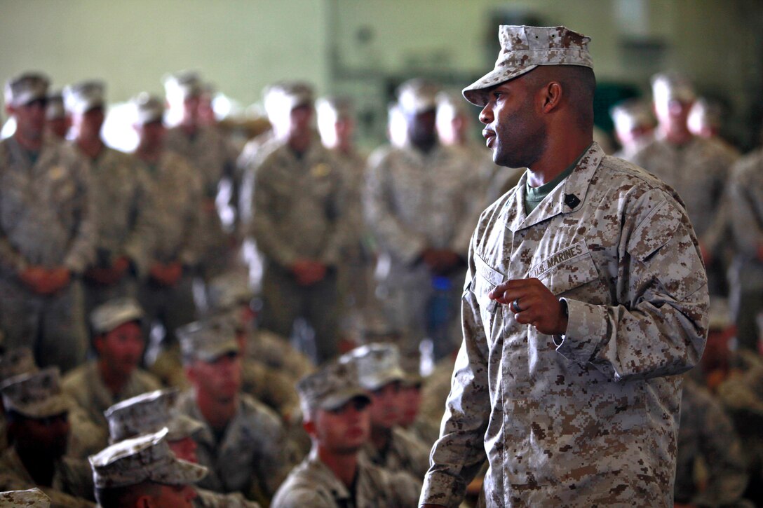 Sergeant Maj. John W. Scott, sergeant major, 15th Marine Expeditionary Unit, talks to Marines during a safety brief in the hanger bay of the USS Peleliu as it leaves San Diego, July 18, beginning Composite Unit Training Exercise (COMPTUEX) 2012. The pre-deployment exercise will evaluate the ARG’s ability to conduct integrated military operations and support the 15th MEU as it conducts training operations at sea and ashore in a realistic training environment.