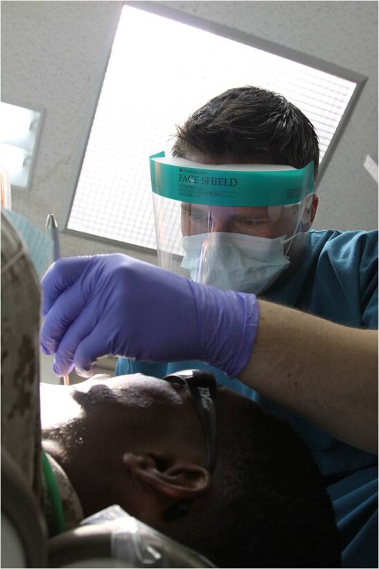 Seaman Apprentice Cody M. Frink, a Robert M. Casey Medical and Dental Clinic dental technician, works on a Marine’s teeth during a dental checkup inside the Branch Health Clinic here July 18, 2012. “Flossing is really important,” said Frink. “It helps fight Gingivitis and gum disease. When Gingivitis starts to get into the more advanced stages, your gums start to recede. You start getting tooth loss and your gums will bleed when you brush them.”