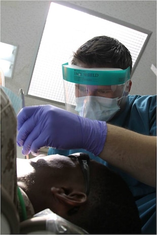 Seaman Apprentice Cody M. Frink, a Robert M. Casey Medical and Dental Clinic dental technician, works on a Marine’s teeth during a dental checkup inside the Branch Health Clinic here July 18, 2012. “Flossing is really important,” said Frink. “It helps fight Gingivitis and gum disease. When Gingivitis starts to get into the more advanced stages, your gums start to recede. You start getting tooth loss and your gums will bleed when you brush them.”