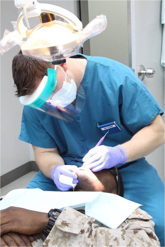 Seaman Apprentice Cody M. Frink, a Robert M. Casey Medical and Dental Clinic dental technician, works on a Marine’s teeth during a dental checkup inside the Branch Health Clinic here July 18, 2012. Mistakes such as not flossing, brushing too hard, not brushing long enough and various other tendencies could cause one to experience pain, cavities and even tooth loss.