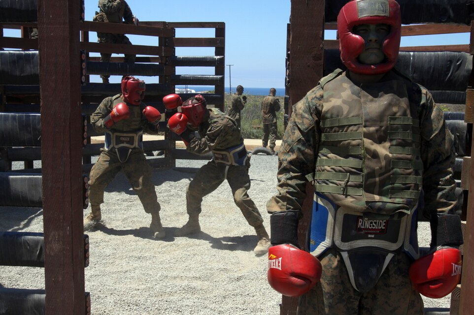 A recruit of Company K, 3rd Recruit Training Battalion, mentally prepares as he waits for his turn to fight during a body sparring match as part of the Crucible, aboard Edson Range, Marine Corps Base Camp Pendleton, Calif. July 17. Recruits, matched in height and weight, fought each other, utilizing the skills they learned in Marine Corps Martial Arts Program throughout recruit training.