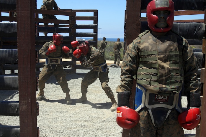 A recruit of Company K, 3rd Recruit Training Battalion, mentally prepares as he waits for his turn to fight during a body sparring match as part of the Crucible, aboard Edson Range, Marine Corps Base Camp Pendleton, Calif. July 17. Recruits, matched in height and weight, fought each other, utilizing the skills they learned in Marine Corps Martial Arts Program throughout recruit training.