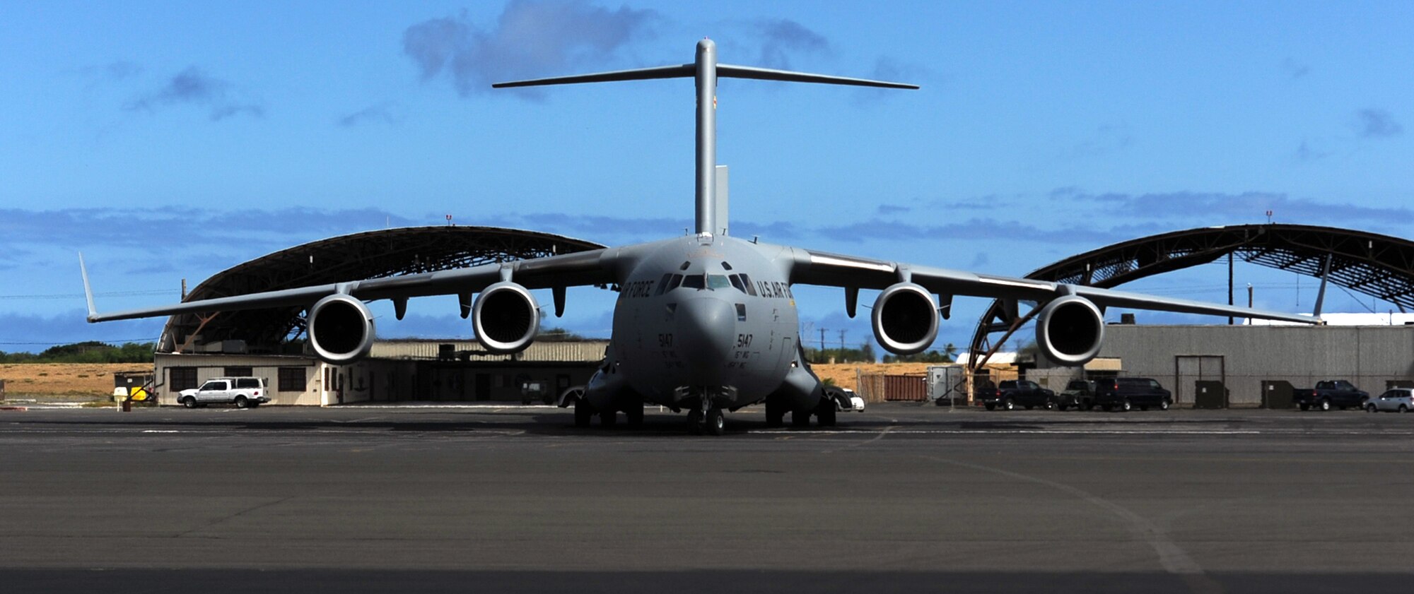 A C-17 Globemaster III from the 535th Airlift Squadron at Joint Base Pearl Harbor-Hickam, Hawaii, carrying Col. Johnny Roscoe, 15th Wing commander, parks July 18 following Roscoe's first flight since taking command of the 15th Wing. The flight was part of the Rim of the Pacific military exercise; the largest naval exercise in the world. (U.S. Air Force photo by Staff Sgt. Nathan Allen)
