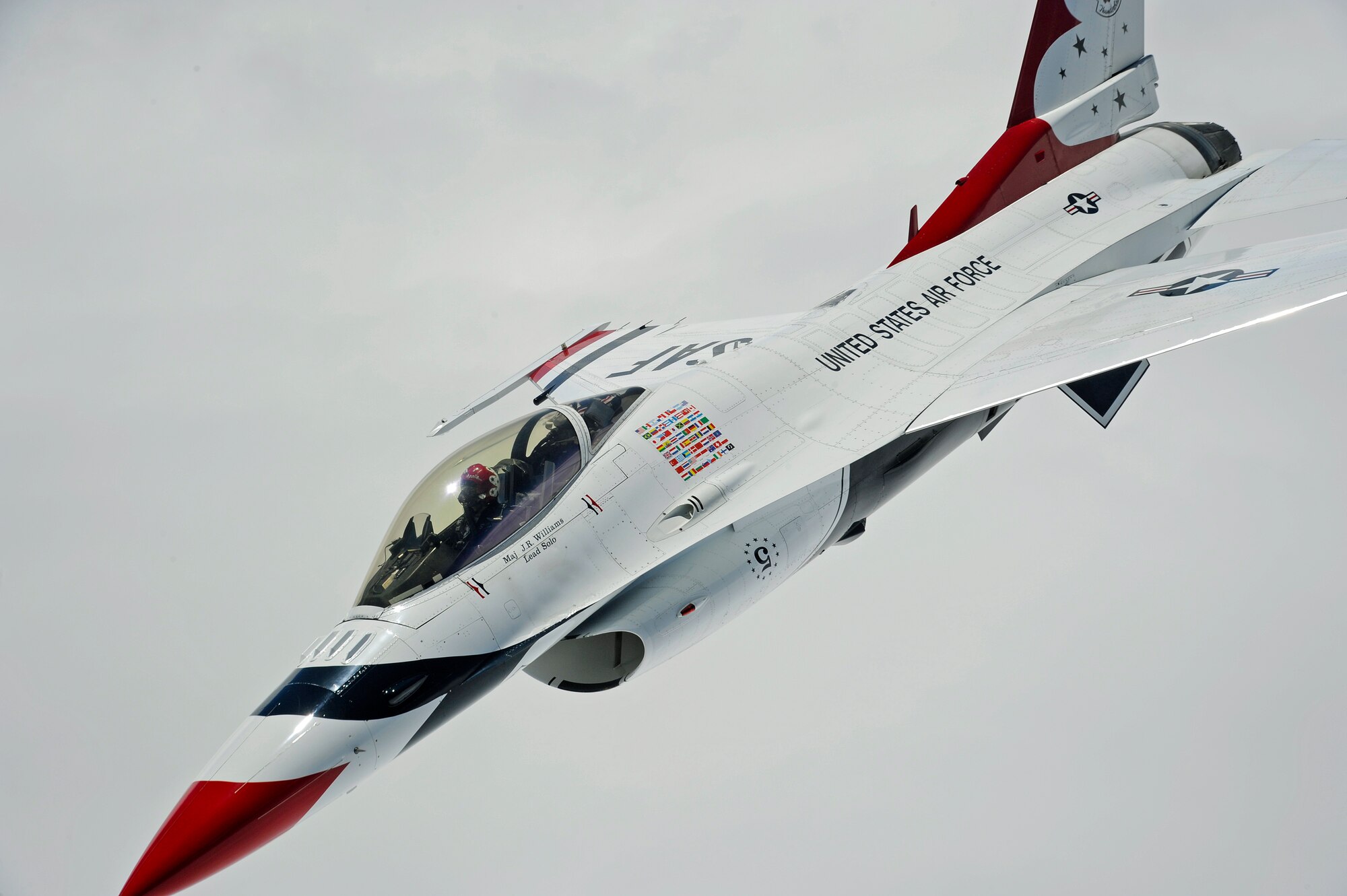 An F-16 Fighting Falcon with the U.S. Air Force Aerial Demonstration Squadron Thunderbirds fly alongside a KC-135 Stratotanker from Fairchild Air Force Base, Wash., July 19, 2012. The Thunderbirds are making their way to the Joint Base Lewis-McChord Air Expo, July 21 to 22. (U.S. Air Force photo by Airman 1st Class Ryan Zeski)