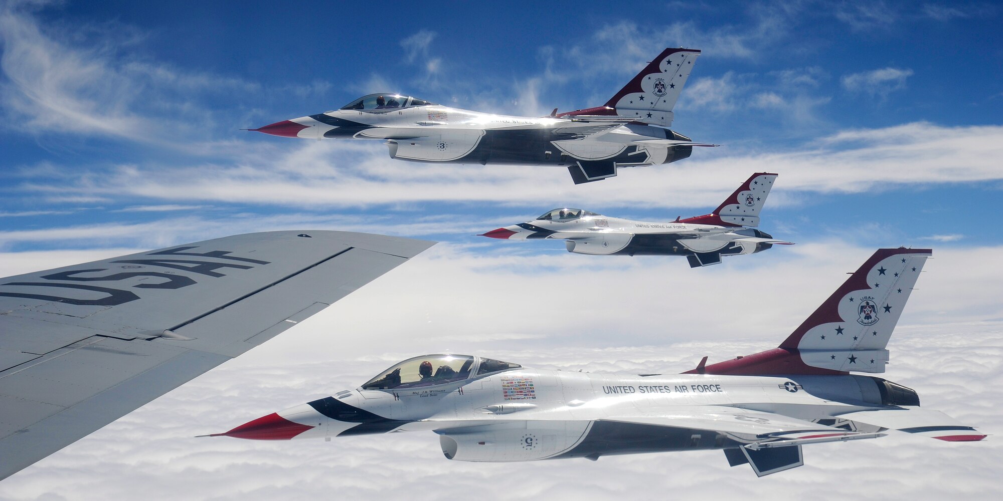 F-16 Fighting Falcons with the U.S. Air Force Aerial Demonstration Squadron Thunderbirds fly alongside a KC-135 Stratotanker from Fairchild Air Force Base, Wash., prior to refueling, July 19, 2012. The Thunderbirds are making their way to the Joint Base Lewis-McChord Air Expo, July 21 to 22. (U.S. Air Force photo by Airman 1st Class Ryan Zeski)