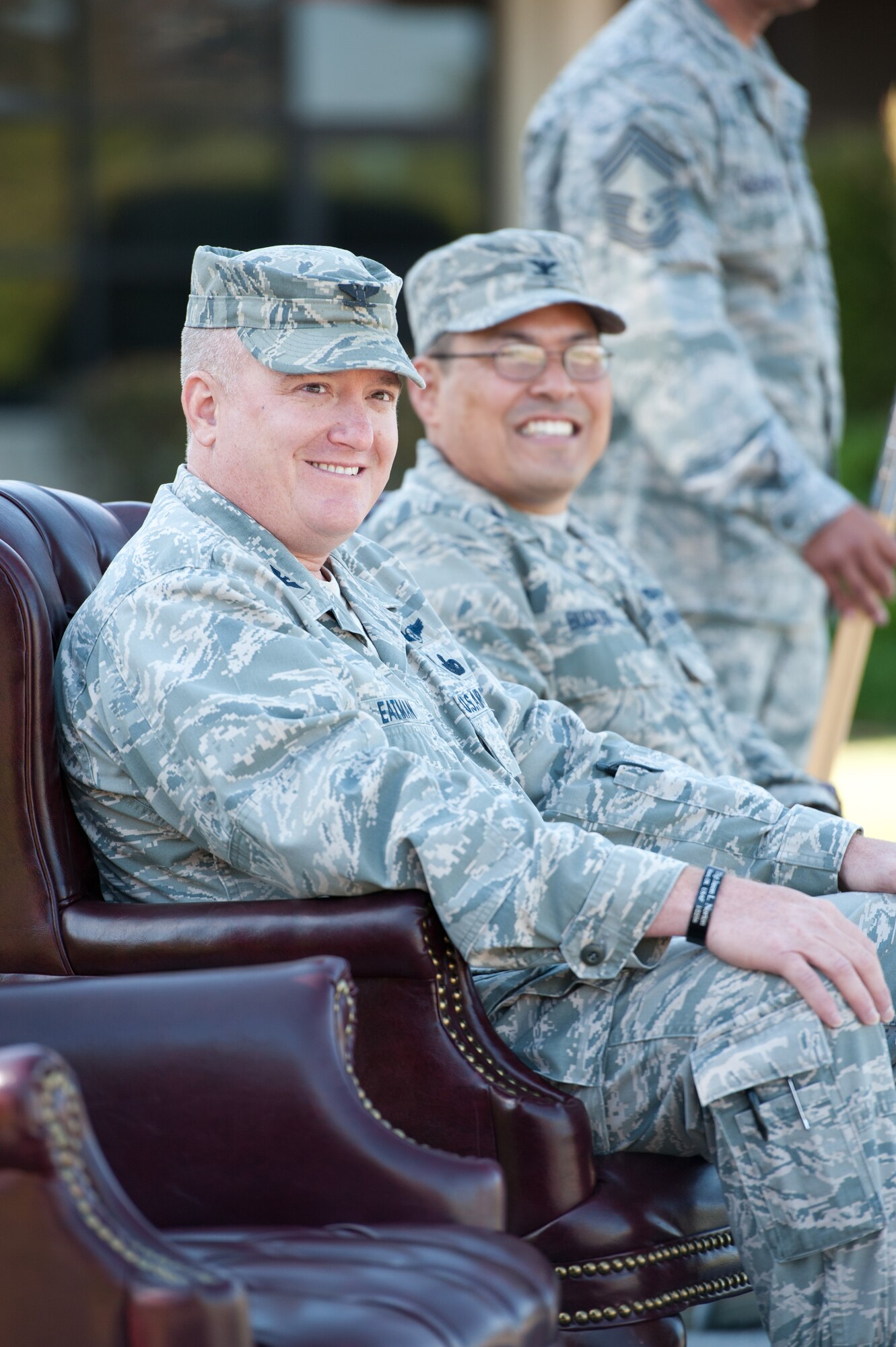 Former 60th Mission Support Group commander, Col. Robert Eatman, and incoming commander, Col. Harold Bugado, listen to the opening remarks at the July 13 Change of Command ceremony.  (USAF Photo/Ken Wright)
