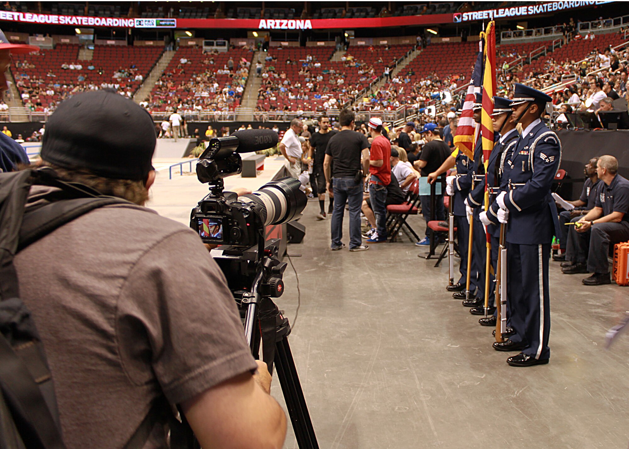 Members of the Luke Air Force Base Honor Guard, prepare to present the colors during the national anthem at Jobing.com Arena in Glendale, Ariz., July 14. The team opened up the first day of competition for the Street League Extreme Skateboarding challenge. Accompanying the Honor Guard was Staff Sgt. Rickie Rosales, dental assistant, 944th Medical Squadron, who sang the Star Spangled Banner. (U.S. Air Force Photo by Tech. Sgt. Meredith Mingledorff)