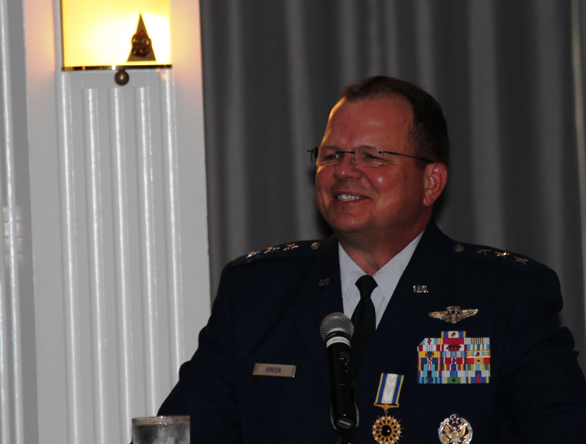 Lt. Gen. Charles B. Green, Air Force Surgeon General, speaks to a crowd at his retirement after 34 years of service during a ceremony on July 19 at the Bolling Club. (Photo by Jon Stock, U.S. Air Force)