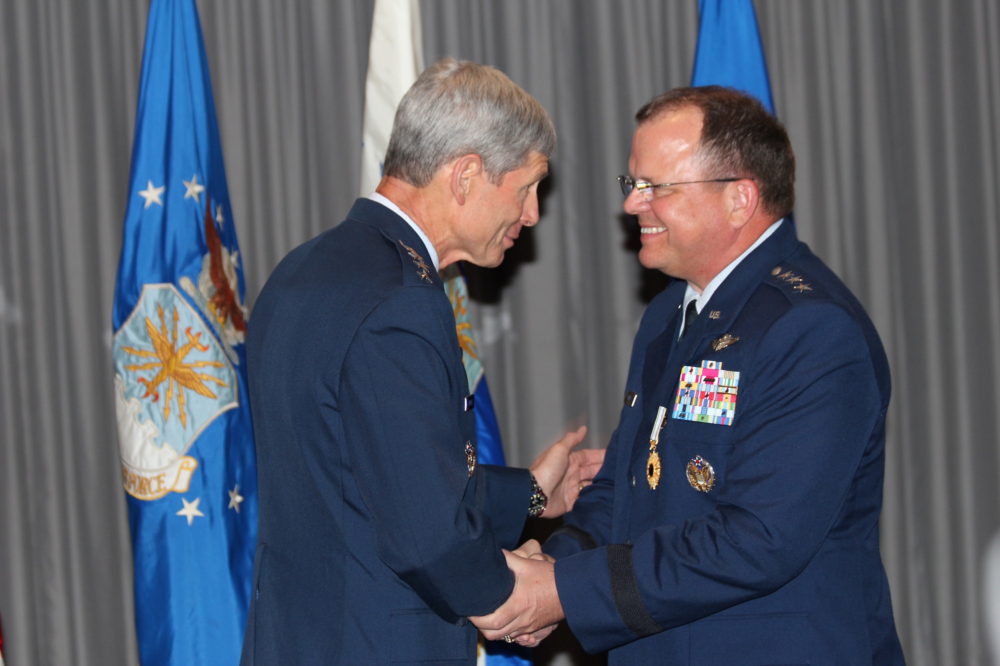 Air Force Chief of Staff Gen. Norton A. Schwartz officiates the retirement of Lt.  Gen. Charles B. Green, Air Force Surgeon General, after 34 years of service during a ceremony on July 19 at the Bolling Club. (Photo by Jon Stock, U.S. Air Force)