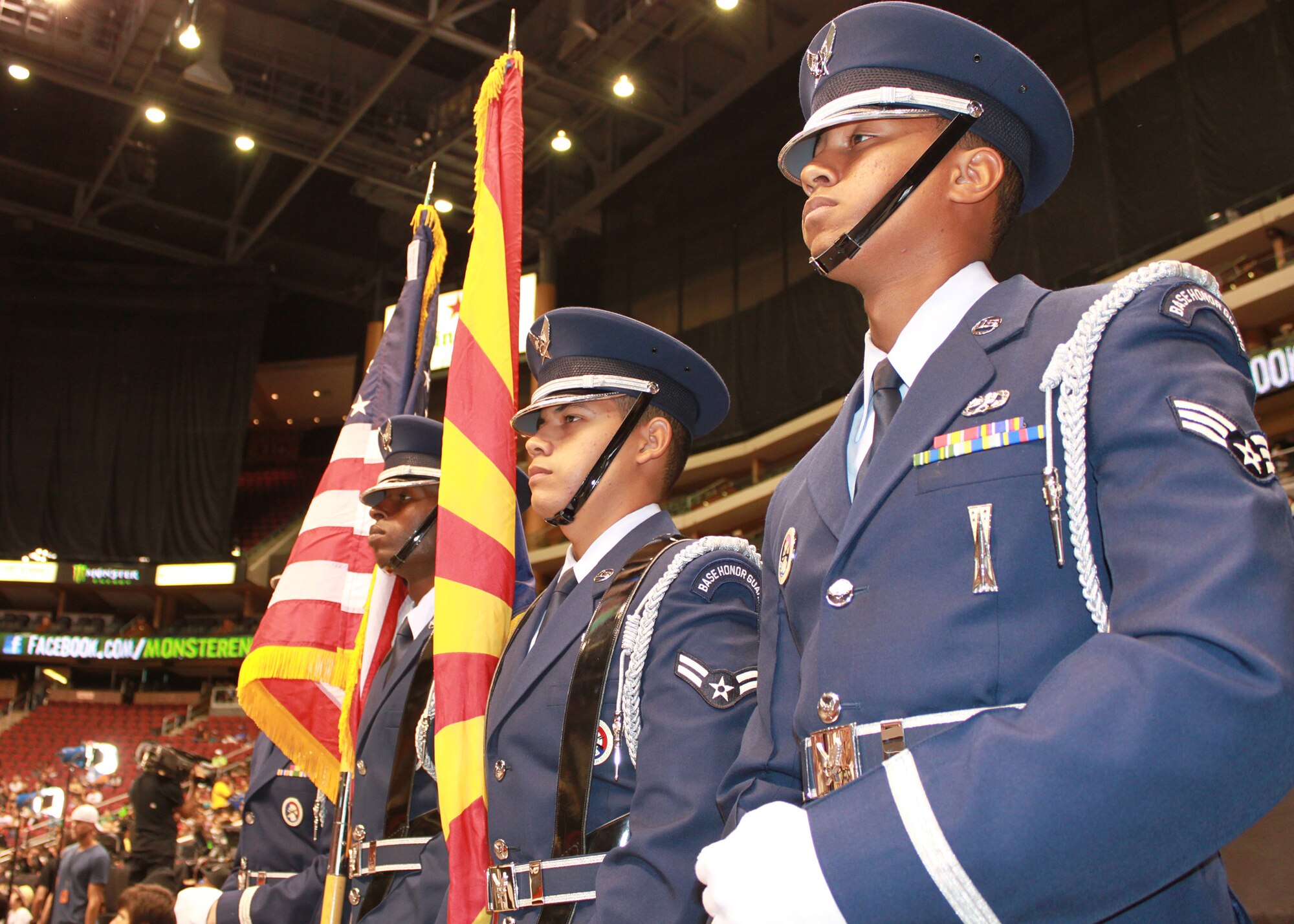 Members of the Luke Air Force Base Honor Guard, prepare to present the colors during the national anthem at Jobing.com Arena in Glendale, Ariz., July 14. The team opened up the first day of competition for the Street League Extreme Skateboarding challenge. Accompanying the Honor Guard was Staff Sgt. Rickie Rosales, dental assistant, 944th Medical Squadron, who sang the Star Spangled Banner. (U.S. Air Force Photo by Tech. Sgt. Meredith Mingledorff)