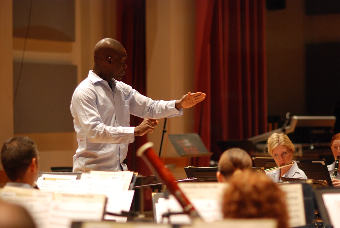 International guest conductor rehearses with the Concert Band Capt. Abiodoun Patrick Odjo in preparation for concerts on July 20, 23 and 24 (AF photo by Master Sgt. Bob Kamholz)