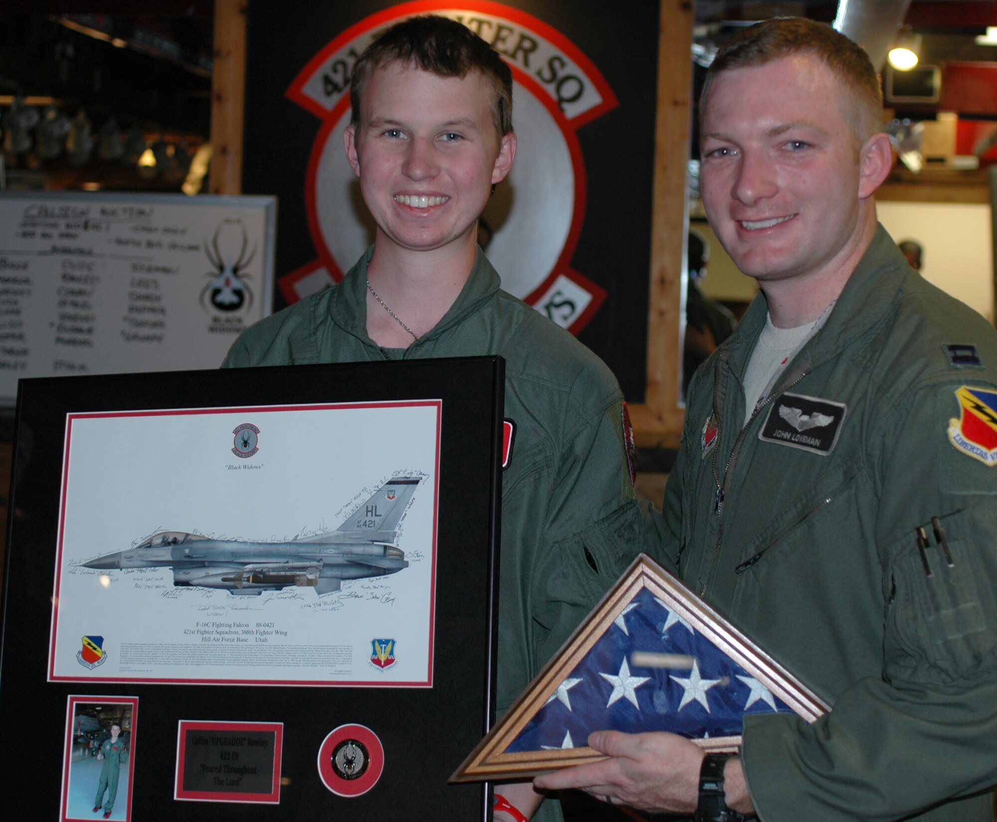 Honorary ‘Pilot for a Day’ Collin Rowley (left) spent time with the 388th Fighter Wing July 12 at Hill Air Force Base, Utah. Capt. John Loveman, an F-16 pilot with the 421st Fighter Squadron, escorted Rowley and his family to the simulator, air traffic tower and a static display. Rowley was diagnosed with metastatic medulloblastoma, a fatal brain tumor. (U.S. Air Force photo by Andrea Mason/Released).