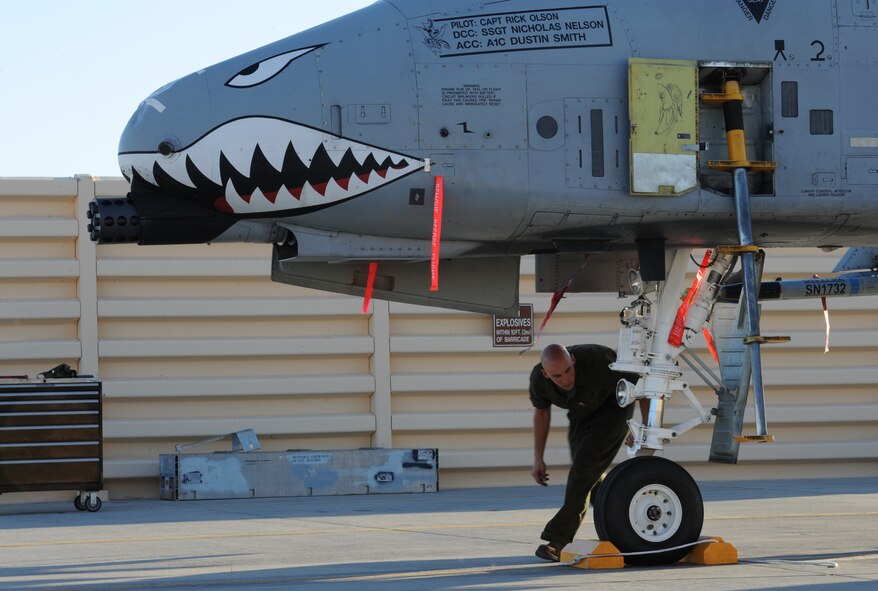 U.S. Air Force Staff Sgt. Nicholas Nelson, a crew chief with the 23d Aircraft Maintenance Squadron, 74th Aircraft Maintenance Unit, performs post-flight inspections on an an A-10C Thunderbolt II at Nellis Air Force Base, Nev., July 16, 2012, during exercise Red Flag 12-4.  The crew chief's walk around begins two and a half hours before the pilot shows up, and they complete another walk around inspection with the pilot before takeoff. (U.S. Air Force photo by Master Sgt. Sonny Cohrs/Released)     