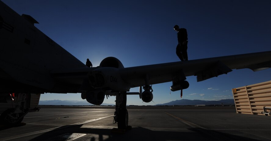 U.S. Air Force Staff Sgt. Michael Baker, 23d Aircraft Maintenance Squadron, 74th Aircraft Maintenance Unit, walks on the wing of an A-10C Thunderbolt II following flight at the Nevada Training and Test Range July 16, 2012.  Baker and about 200 other Airmen are deployed to Nellis Air Force Base, Nev., for exercise Red Flag 12-4.  (U.S. Air Force photo by Master Sgt. Sonny Cohrs/Released)   