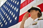 Navy Capt. Gail Hathaway salutes during colors at the Navy Medicine Education and Training Command change of command ceremony at the Naval Air Station Jacksonville., Fla., ceremonial hangar July 11. Hathaway, reporting from her previous assignment as the Medical Education and Training Campus deputy commandant at Joint Base San Antonio-Fort Sam Houston, assumed command during the hour-long ceremony.  (U.S. Navy photo by Larry Coffey)