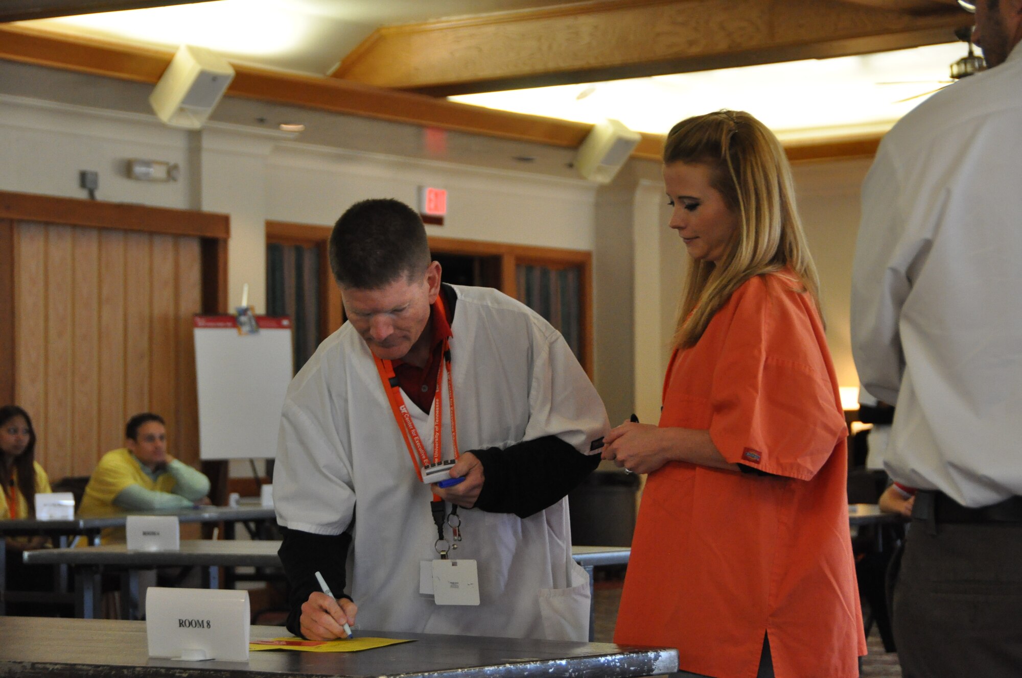 Chief Master Sgt. Mike Heath, left, 60th Medical Support Squadron superintendent, works with 1st Lt. Misti Neill, 60th MDSS, during an exercise Monday at the Travis Conference Center during the Lean for Healthcare course. The course was designed to improve efficiency at David Grant USAF Medical Center. (U.S. Air Force photo/Nick DeCicco)