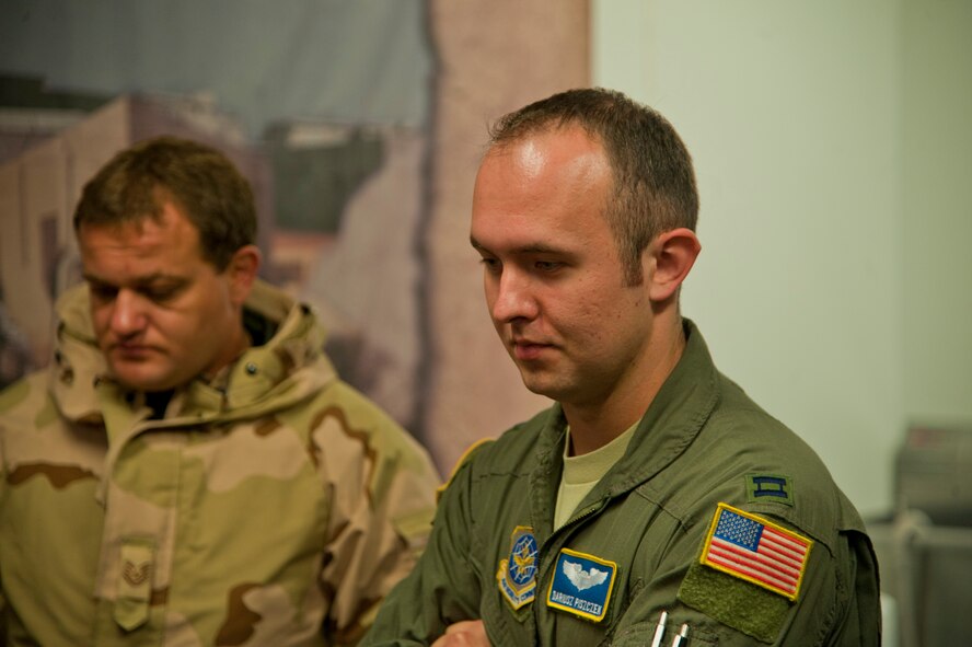 U.S. Air Force Capt. Dariusz Piszczek, a C-17 Globemaster III pilot watches over emergency medical training at the Tactical Operations Medical Skills Lab on Hurlburt Field, Fla., July 6, 2012. Pisczczek is a translator in the Language Enabled Airman Program; the program uses the foreign language skills of Airmen to assist in communicating with foreign allies. (U.S. Air Force photo/ Staff Sgt. John Bainter) (Released)