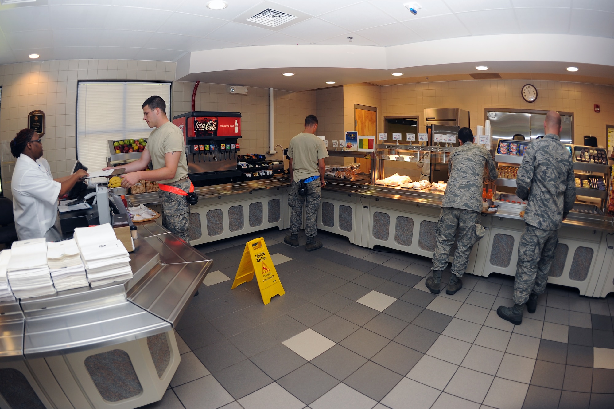Airmen from the 4th Fighter Wing go through a pick-up line in the flight kitchen at Seymour Johnson Air Force Base, N.C., July 17, 2012. The flight kitchen staff prepares daily hot and cold specials including wraps and sandwiches. (U.S. Air Force photo/Airman 1st Class John Nieves Camacho/Released)