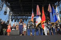 HOUSTON — Grammy-nominated artist Tamar Davis sings the national anthem with a color guard made up of service members from the Houston area, and with Maj. Gen. Walter Davis, deputy commanding general, U.S. Army North, Fort Sam Houston, Texas, and other dignitaries. Davis welcomed the crowd of an estimated 100,000 July 4 to Houston’s Freedom Over Texas at Eleanor Tinsley Park on Buffalo Bayou, one of the nation’s largest land-based fireworks celebrations. Country music stars Billy Currington and Sara Evans headlined the event. (U.S. Army photo by Staff Sgt. Keith Anderson, Army North PAO