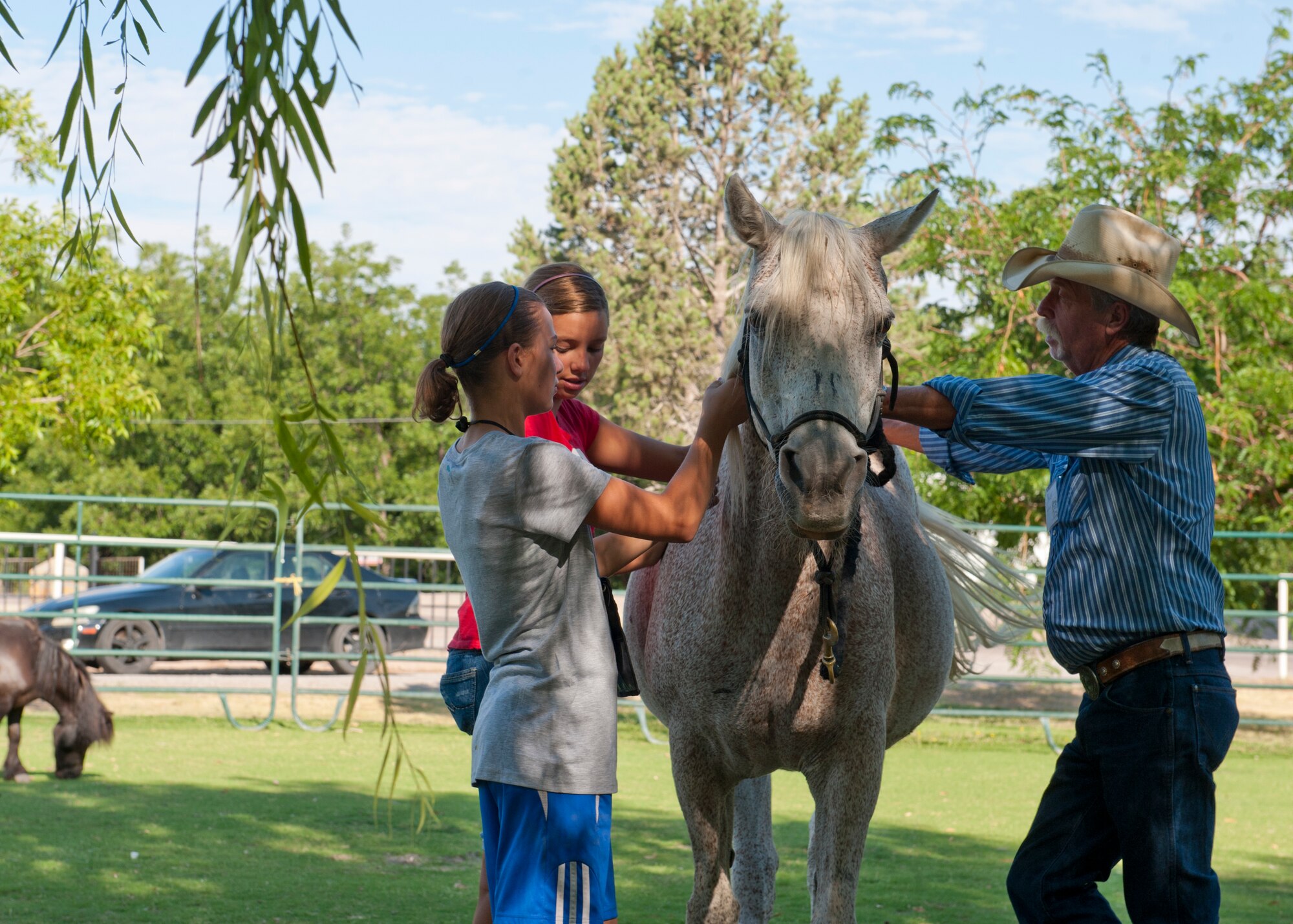 Children with Operation Military Kids learn to communicate with horses at the Las Cruces, N.M., Spirit Ranch July 16. Children from Holloman Air Force Base, N.M.,  participated in a week-long camp at Spirit Ranch in order to hone their coping and communication skills. Horses were used as a tool help children learn how to balance their psyche. (U.S. Air Force photo by Airman 1st Class Daniel E. Liddicoet/Released)