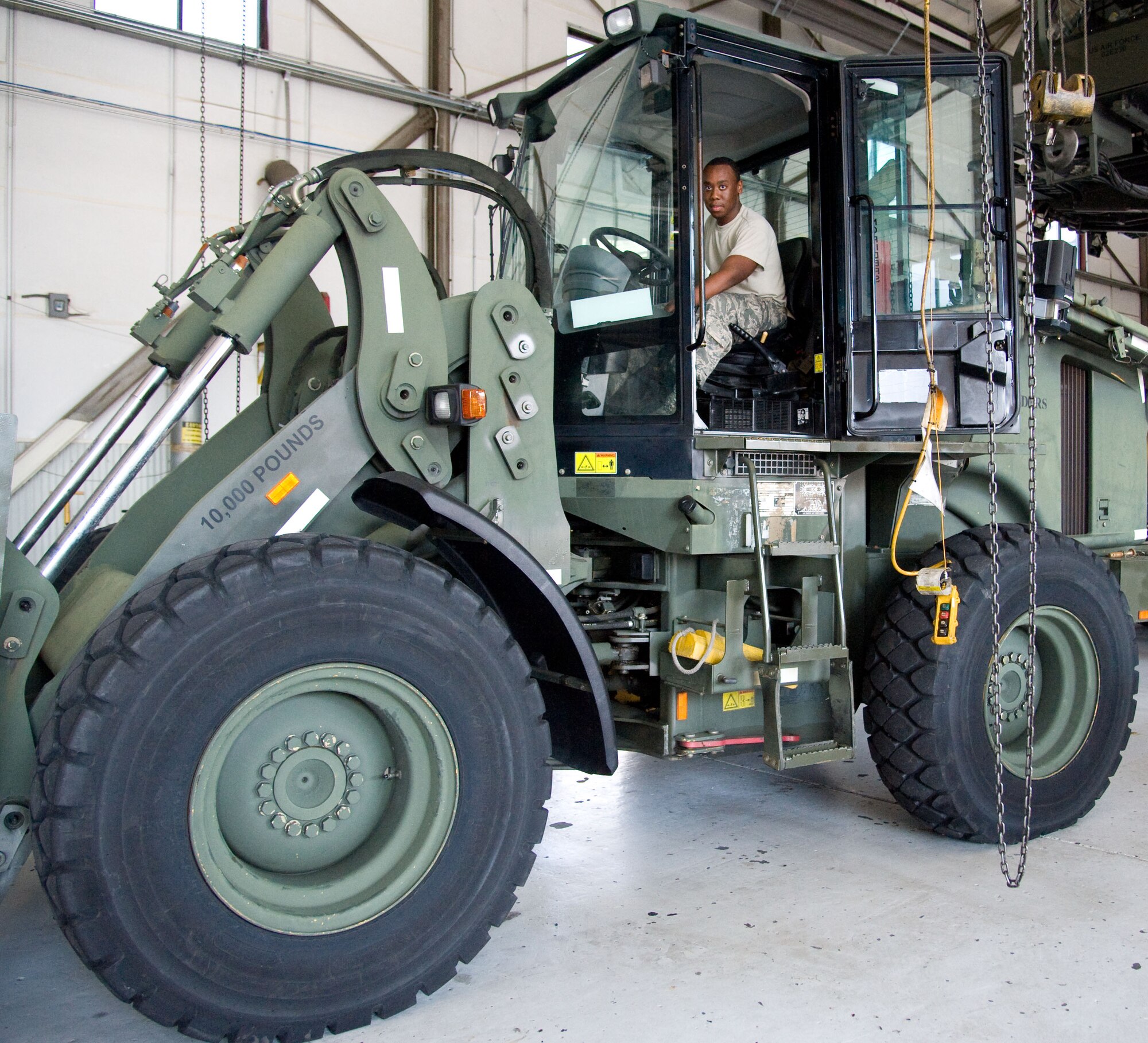 Airman 1st Class Lamar Hinnant, mechanic with the 436th Logistics Readiness Squadron, operates a forklift July 18, 2012, at Dover Air Force Base, Del. The 436th LRS repairs various vehicles required for cargo transport at Dover AFB. (U.S. Air Force photo by Adrian R. Rowan)