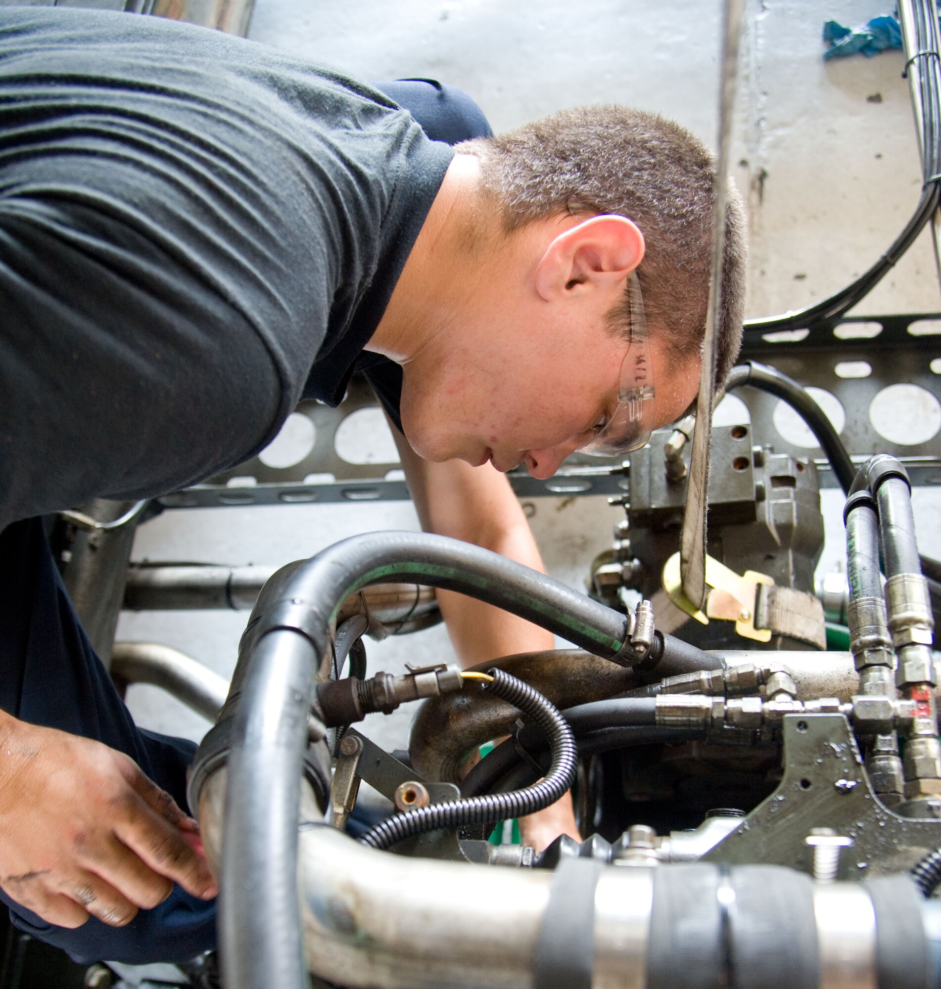 Airman Dyllan Arnold, materials handling and equipment apprentice with the 436th Logistics Readiness Squadron, replaces a front main seal on an engine July 18, 2012, at Dover Air Force Base, Del. The main seal holds all fluids in the engine. (U.S. Air Force photo by Adrian R. Rowan)