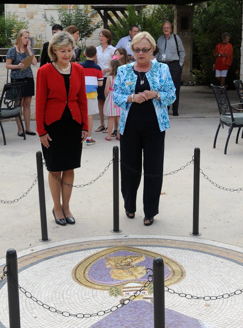 FORT SAM HOUSTON, Texas — Judith Markelz (right), program director, Warrior and Family Support Center, shows Sen. Kay Bailey Hutchison of Texas the tiled Purple Heart mosaic in the grounds of the center. Hutchison attended a private ceremony where the Purple Heart Medal was presented to a Soldier. “This war is not over; and when distinguished visitors like Sen. Hutchison take time to visit with Wounded Warriors, it reminds people that our Wounded Warriors still need help,” Markelz said. “This visit reaffirms the commitment of the State of Texas and the community to support our Wounded Warriors and their Families.” (U.S. Army photo by Staff Sgt. Keith Anderson, Army North PAO)

