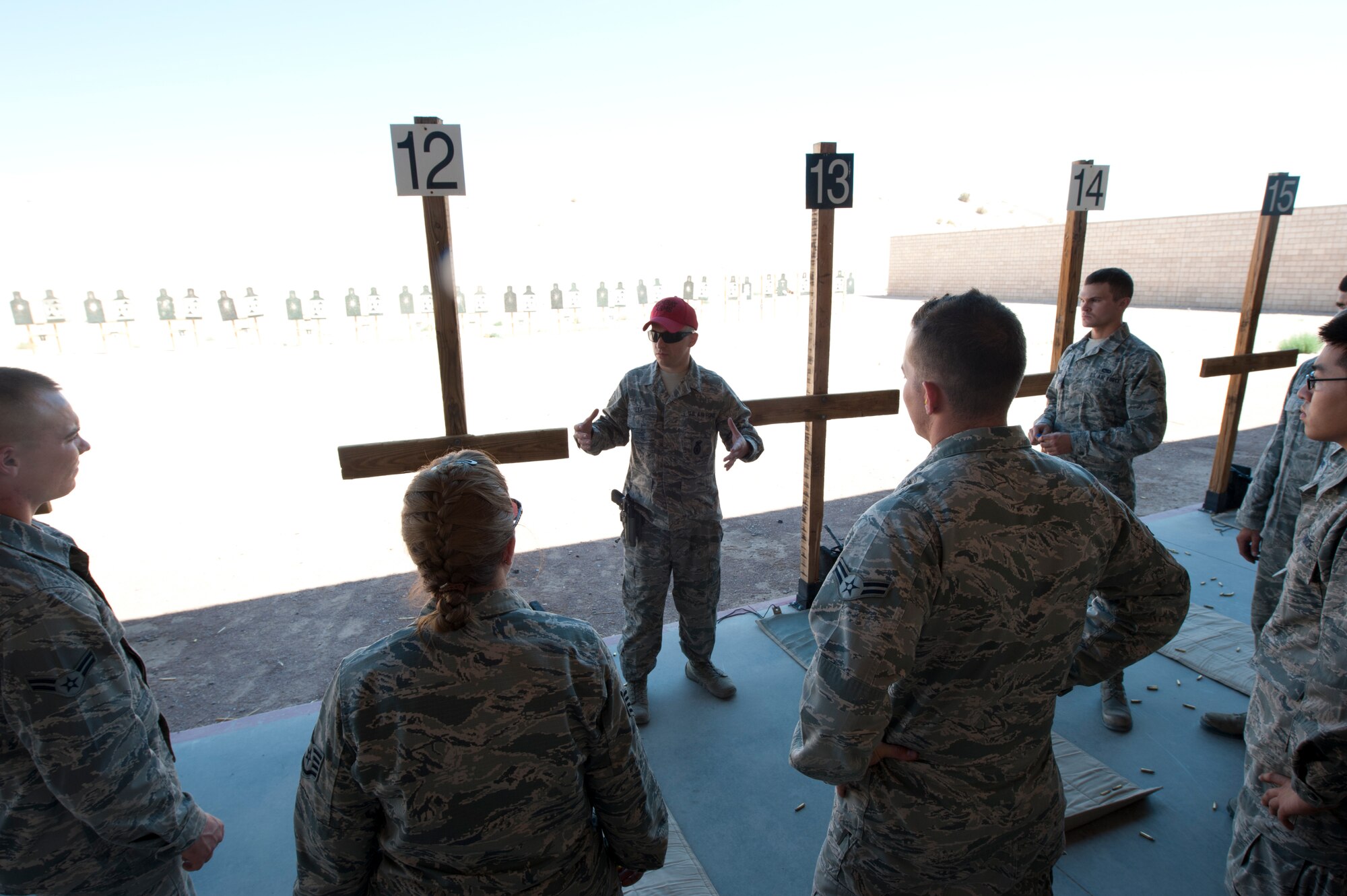 Maintenance students at the Holloman Air Force Base, N.M., CATM range July 18. Before any Holloman Airman goes on a deployment, they must complete the weapons qualifications course, which includes a weapons-familiarization training block taught in the classroom and at the shooting range. To qualify, Airmen must shoot targets at 7, 15 and 25 meters, while going through a combination of multiple target drills, threat discrimination, and burst-fire sessions. (U.S. Air Force photo by Airman Leah Ferrante/Released)