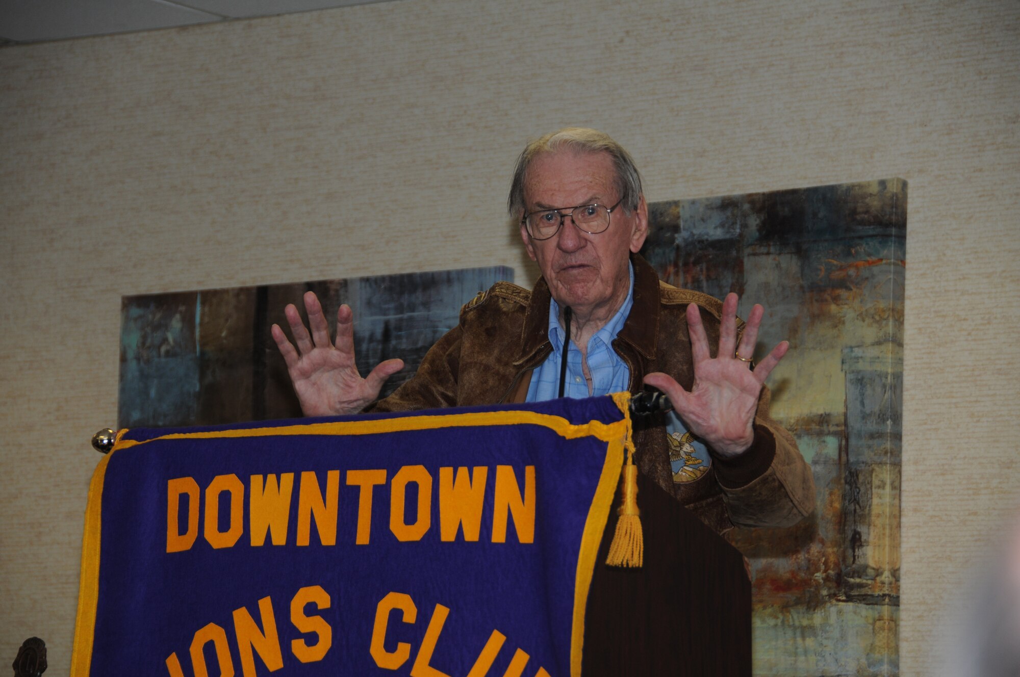 SIOUX FALLS, S.D. - United States Air Force Lt. Col. Wendell Hanson (Ret.) describes his final mission in the China Burma India Theater during World War II, to the Downtown Lions Club members here, 17 July.  Hanson was asked to speak at the luncheon alongside the crew of a Mitchell B-25 that is in town for the Sioux Falls Airshow 2012.  The B-25 and several other historical and modern aircraft will be on display during the ai show 21 and 22 July. (National Guard photo by Tech. Sgt. Quinton Young)(Released)