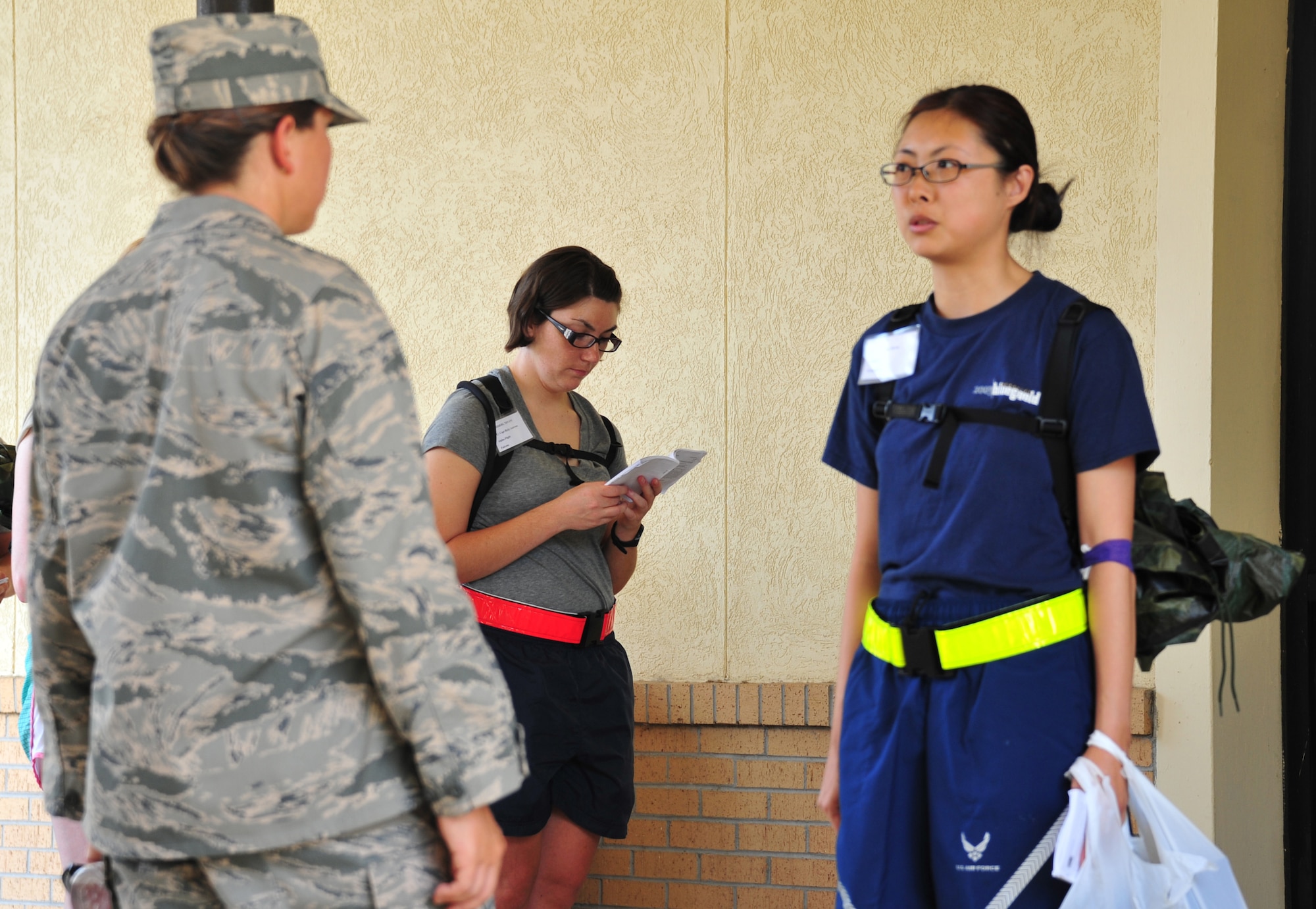 A trainee receives a lesson in how to conduct herself as an officer in the Air Force July 3. Lessons on customs and courtesies are ongoing throughout every portion of the 13-week course. (U.S. Air Force photo by Airman 1st Class William Blankenship) 