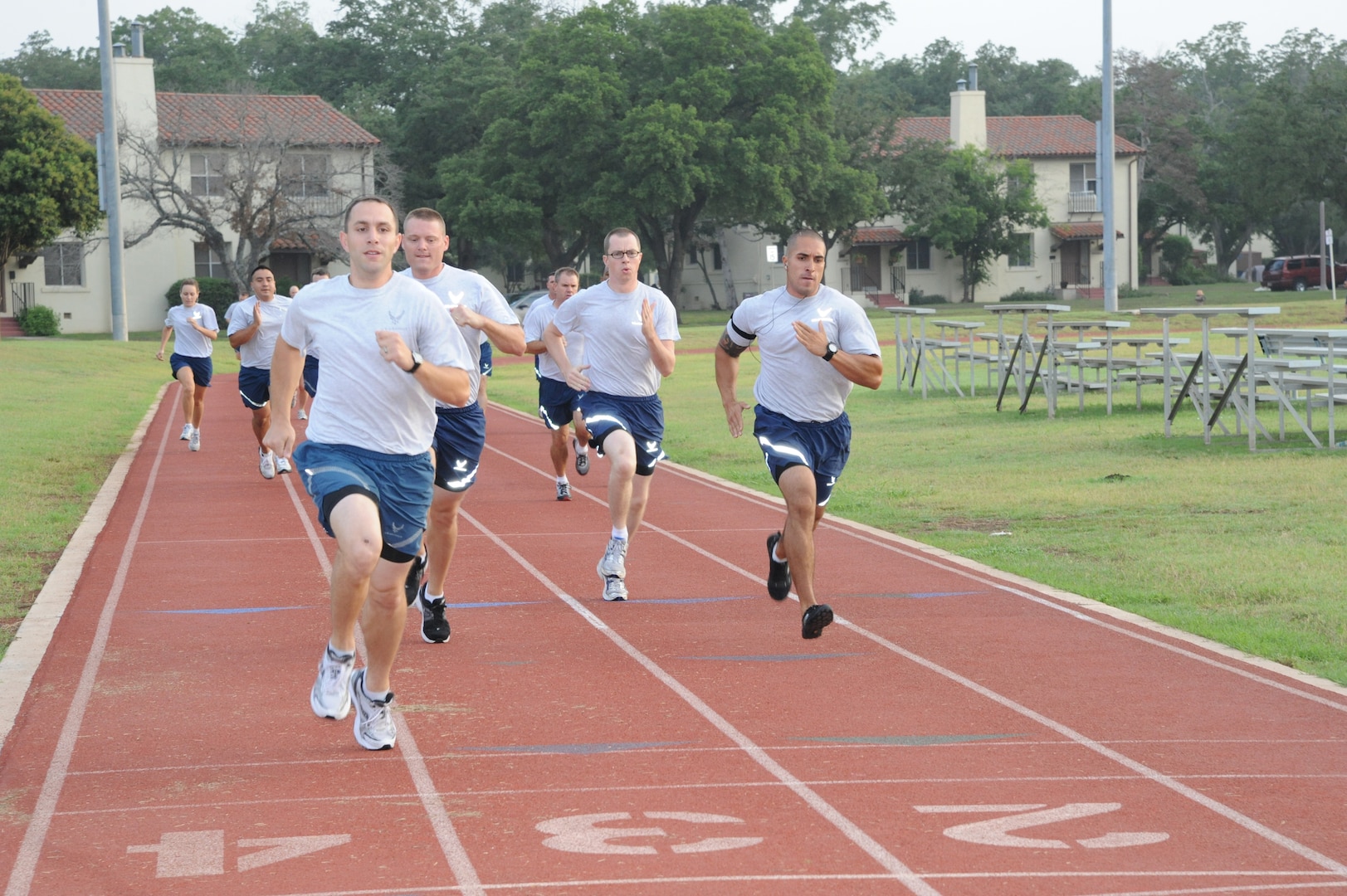 Joint Base San Antonio-Randolph personnel prepare for their physical training test during an early morning run July 13 on the Rambler Fitness Center track at Randolph. (U.S. Air Force photo by Rich McFadden)