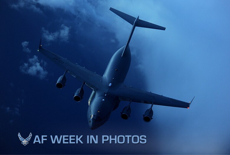 A C-17 Globemaster III, with the 15th Airlift Squadron, pulls away from behind a KC-135 Stratotanker, with the 756th Air Refueling Squadron, during exercise Global Eagles after receiving fuel off the east coast of Florida on July 12, 2012. The C-17 is used for rapid strategic airlift of troops and cargo to main operating bases or forward operating bases throughout the world. (U.S. Air Force photo/Master Sgt. Jeremy Lock)