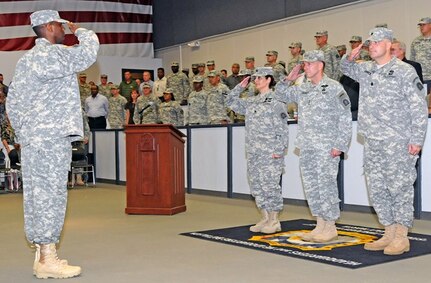 FORT SAM HOUSTON, Texas — Maj. Sedrick Jackson, commander of troops, reports to Lt. Gen. William Caldwell IV (center), reviewing officer, during the Headquarters and Headquarters Battalion, U.S. Army North, change of command ceremony July 12 at the Fort Sam Houston Rehearsal of Concept Drill Facility. Jackson is the executive officer for HHBn, and Caldwell is the commanding general, U.S. Army North, and senior commander, Fort Sam Houston and Camp Bullis. Lt. Col. Shannon Miller (left) relinquished command of the battalion to Lt. Col. Zoltan Krompecher (right). Also during the battalion’s inaugural change of command and change of responsibility ceremony, Command Sgt. Maj. Alvin Chaplin Sr. assumed responsibility for the battalion from Command Sgt. Maj. Eddie Fields III.  (U.S. Army photo by Sgt. 1st Class Christopher DeHart, Army North PAO)